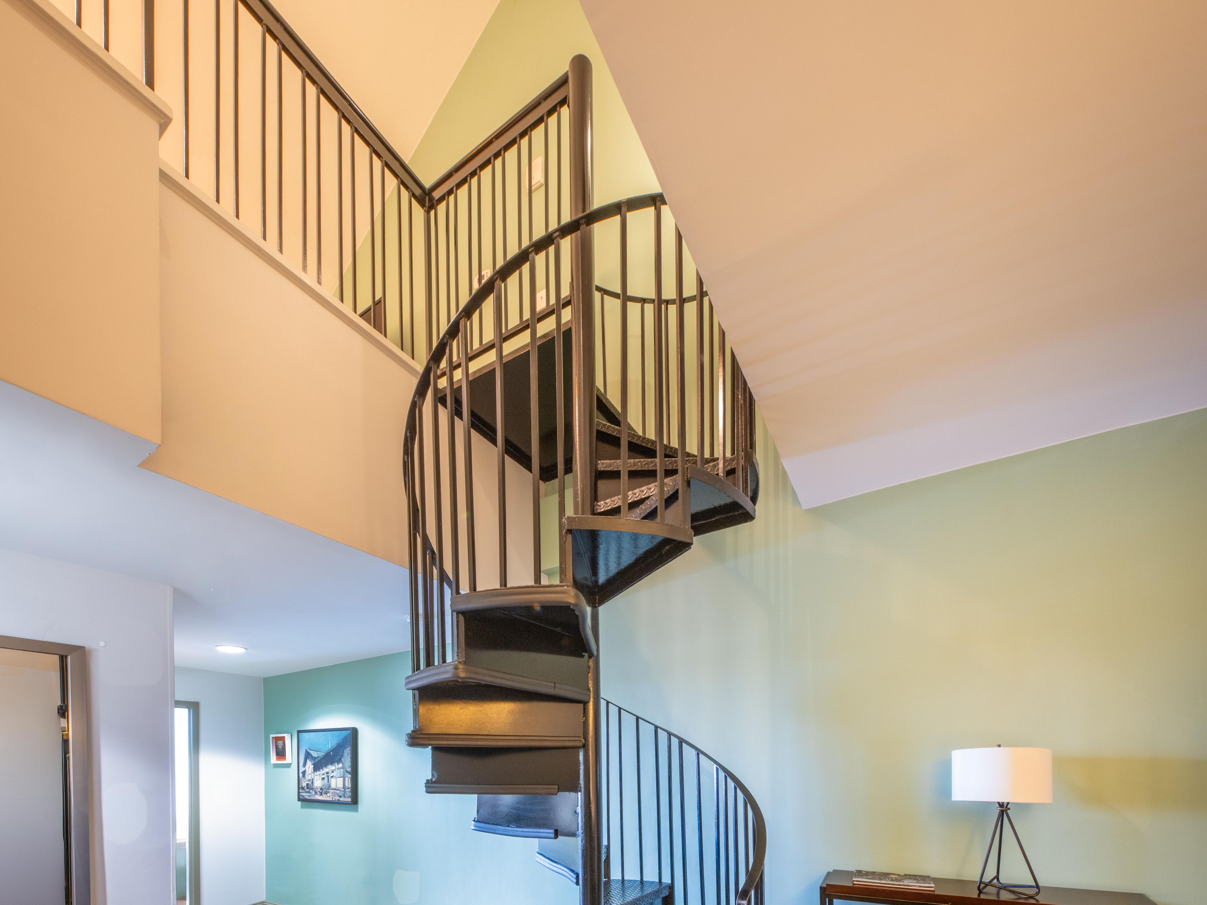 A spiral staircase connects the two levels of your suite.