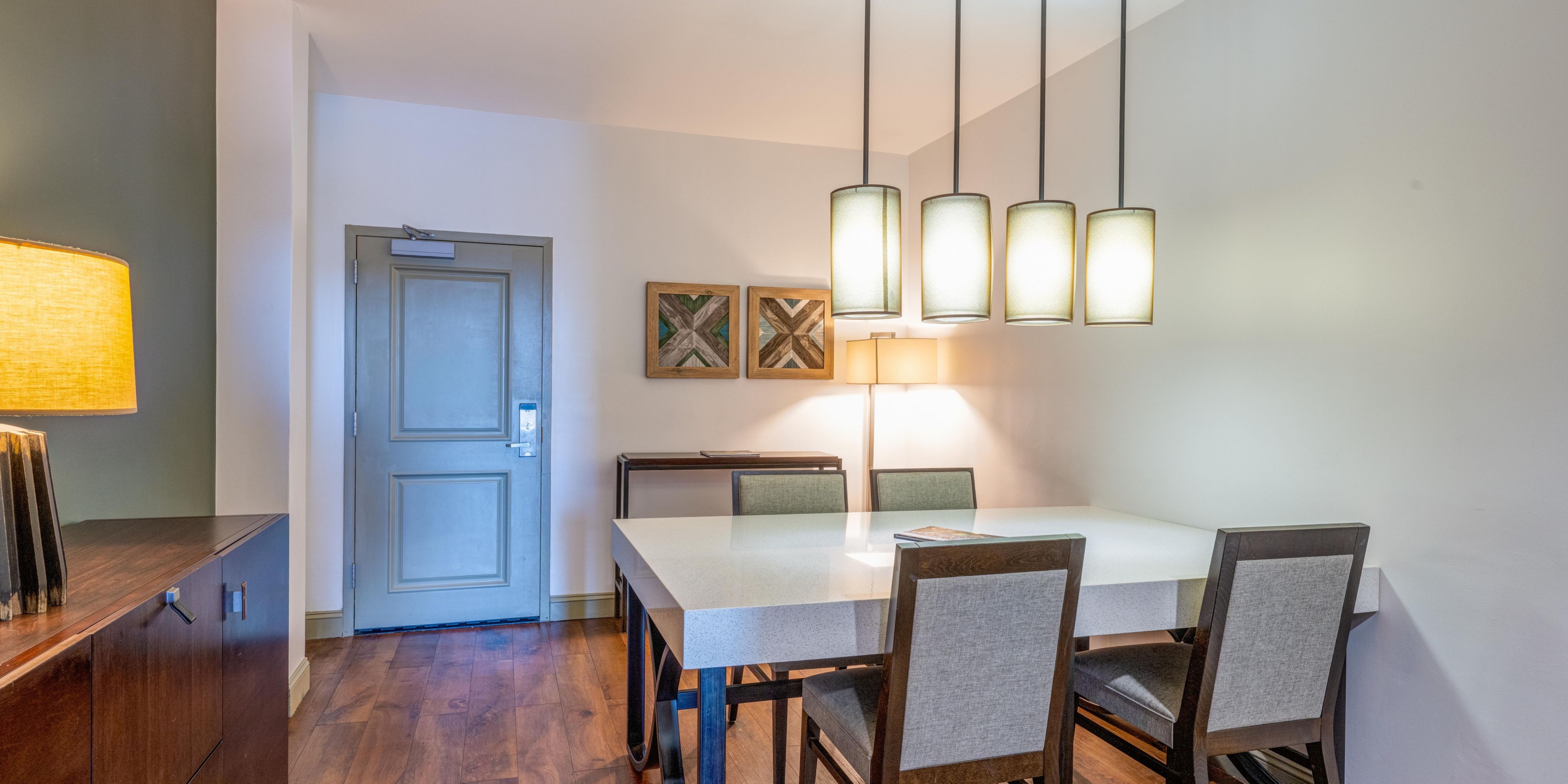 Gather around the dining table in your one-bedroom suite.