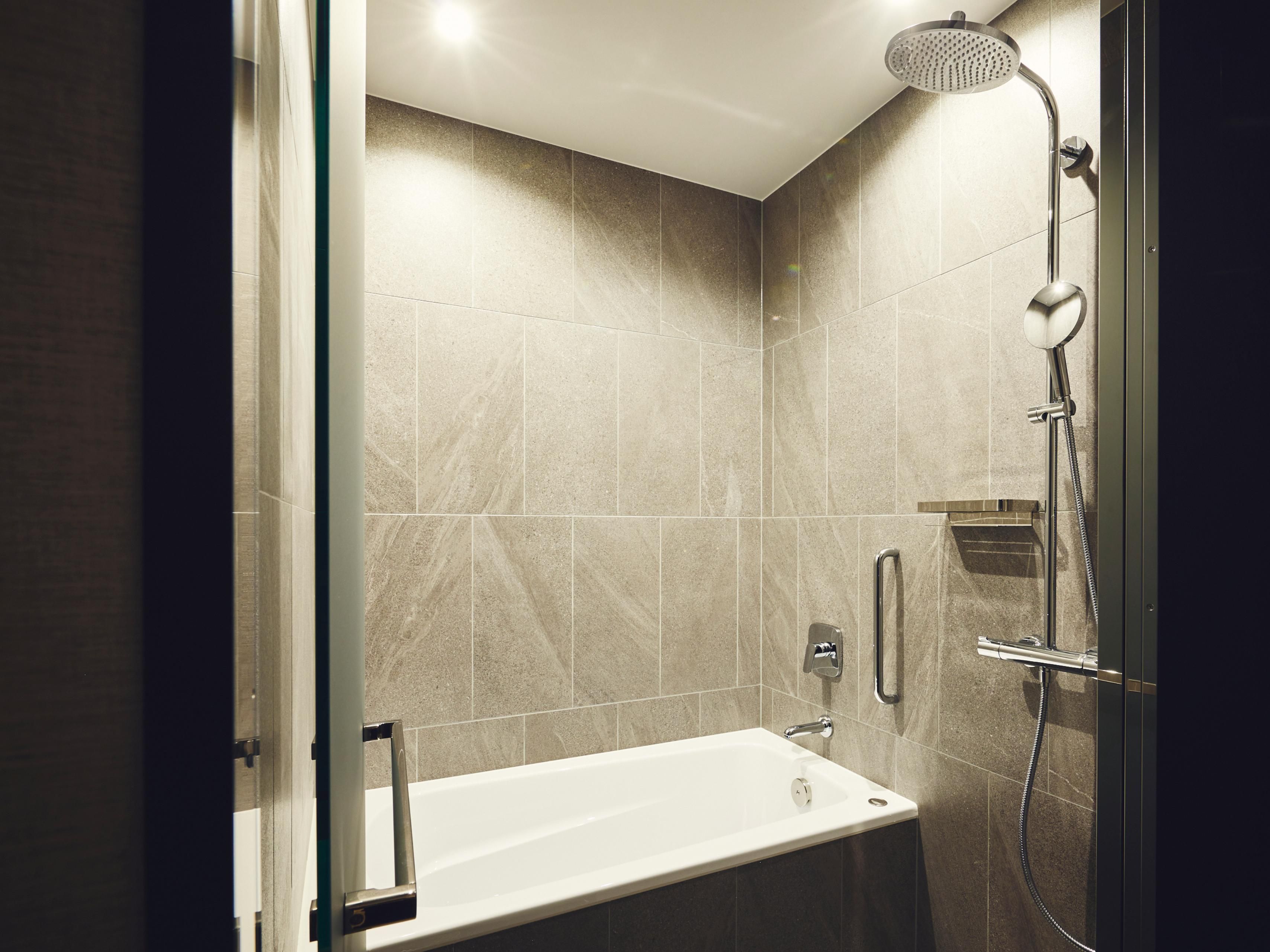After a day of exploring, unwind in our guestrooms with bathtub