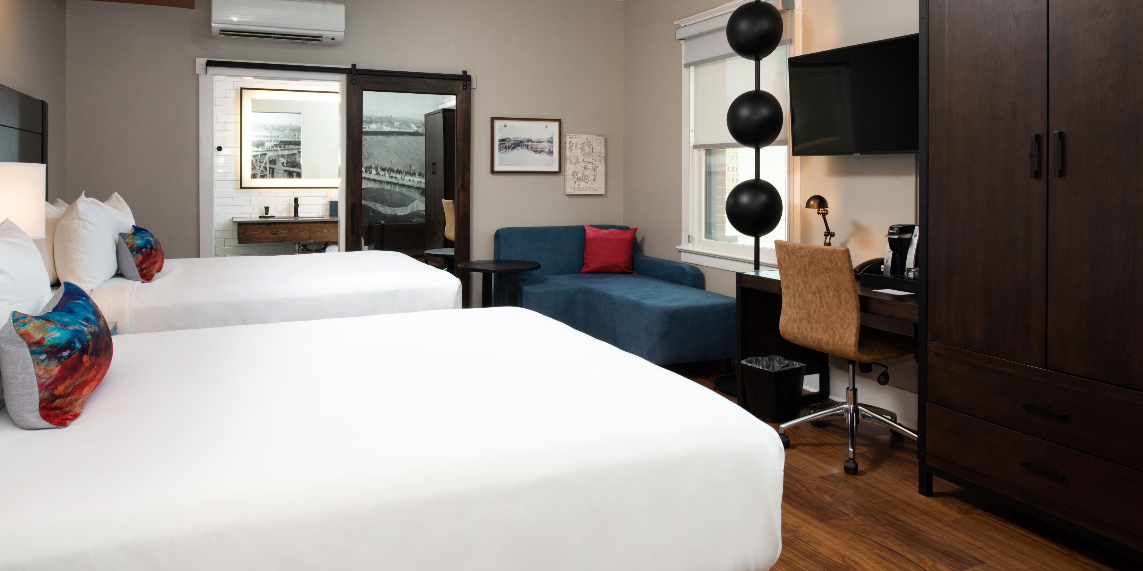 Hotel Indigo Spokane. Deluxe room with two queen beds. 