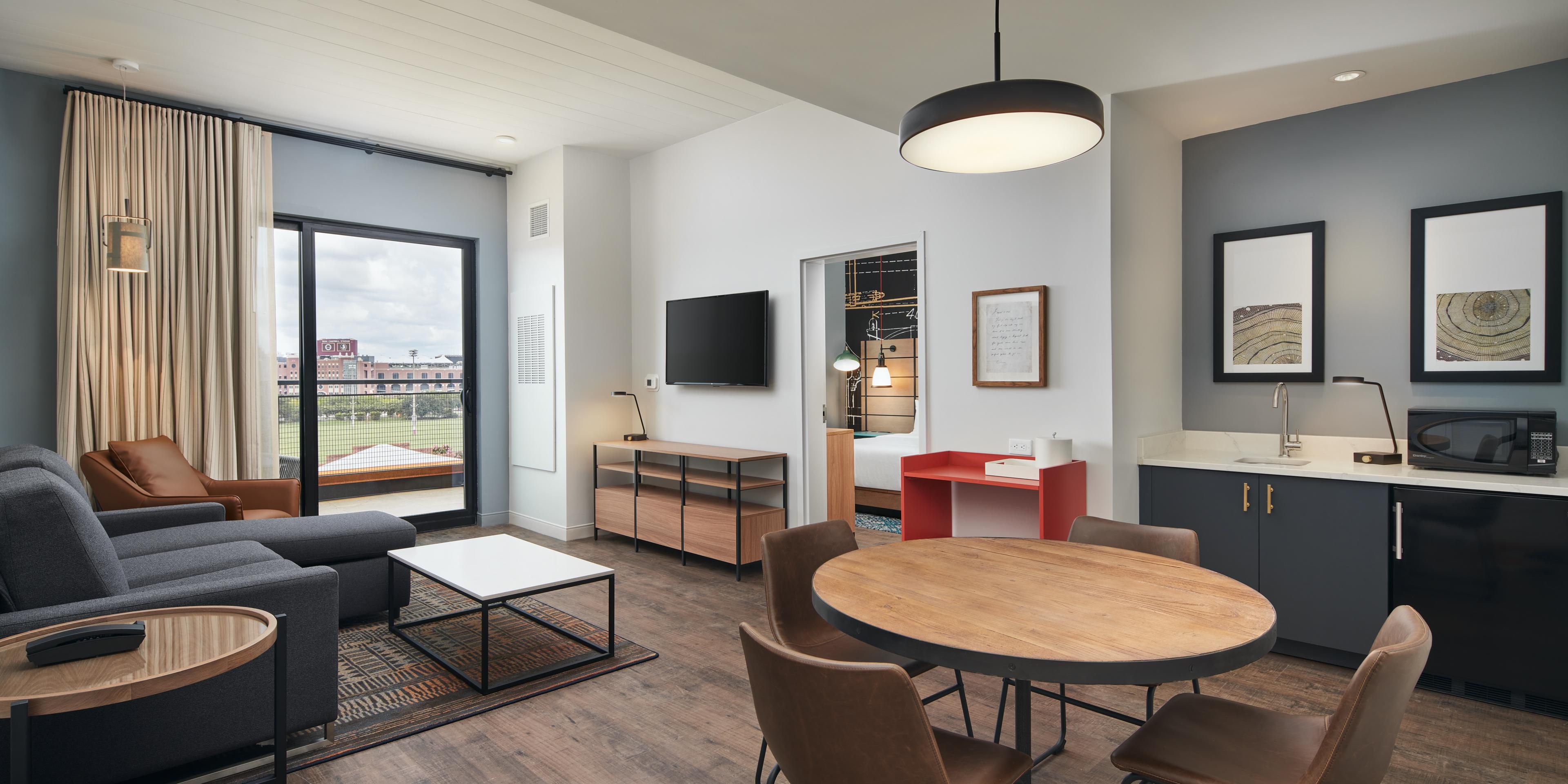 Spacious room with balcony view of FSU stadium and campus