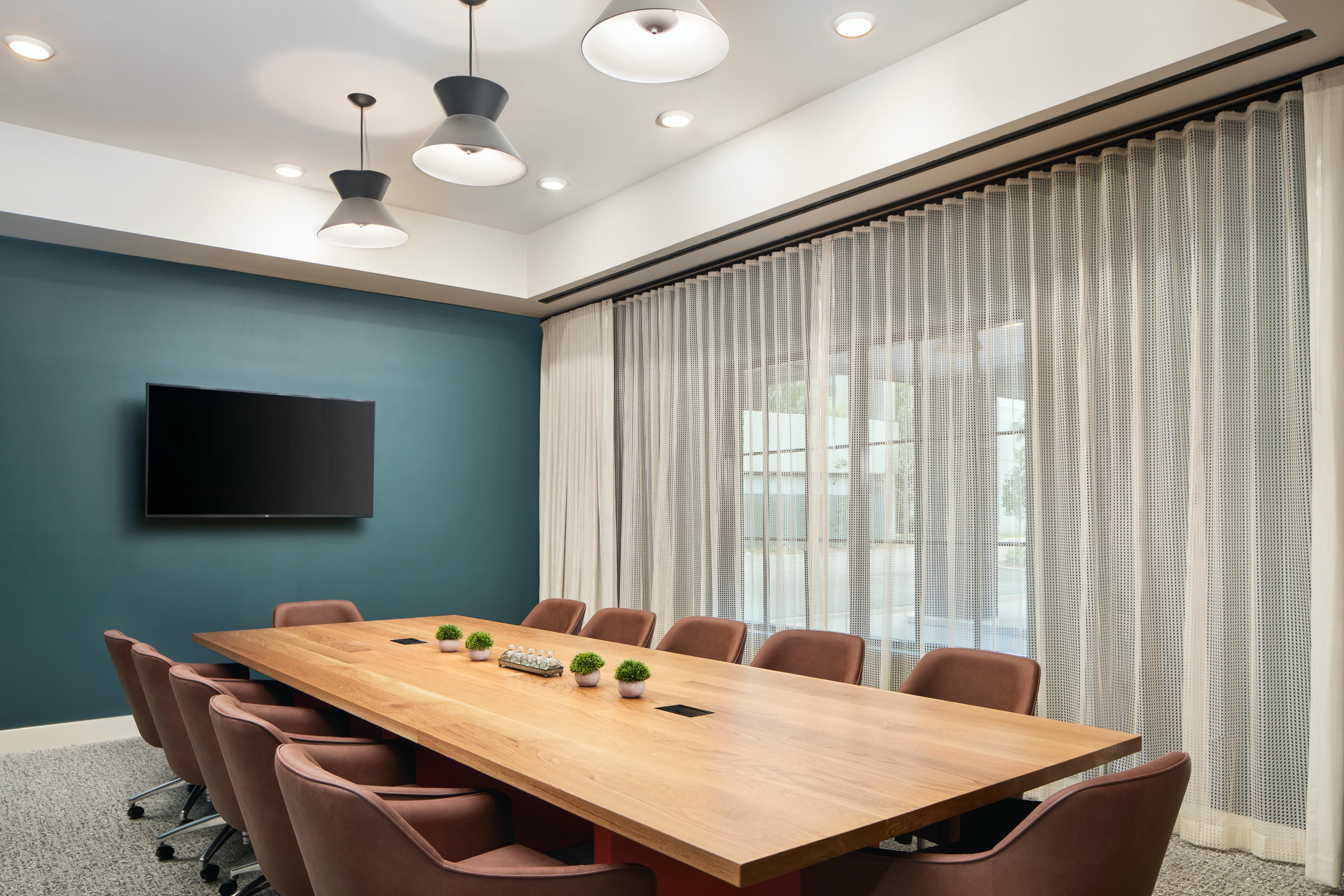 Boardroom meeting room that accommodates 12 guests.