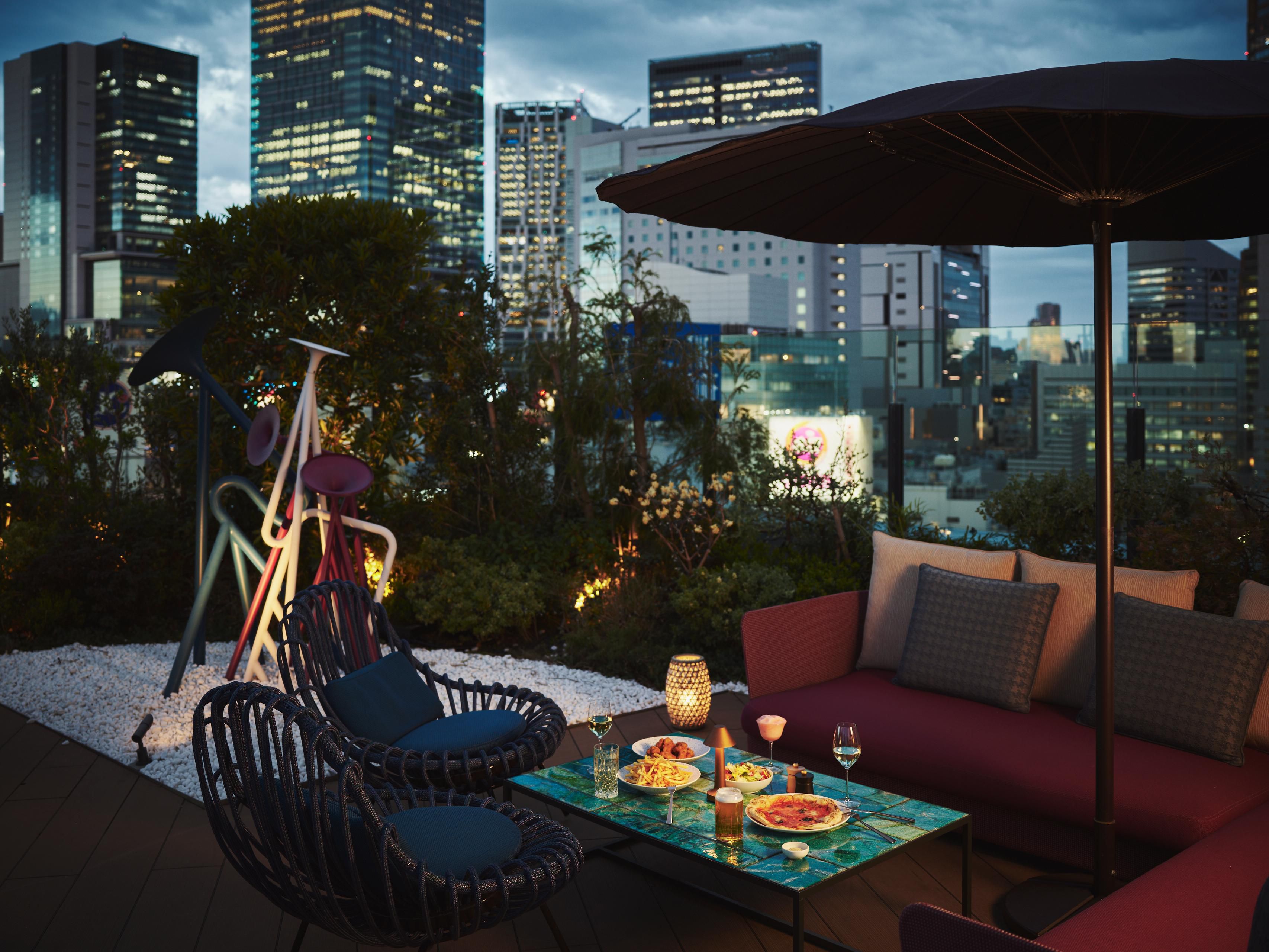 Pink Flamingo Beer Garden framed by Shibuya’s vibrant city lights.