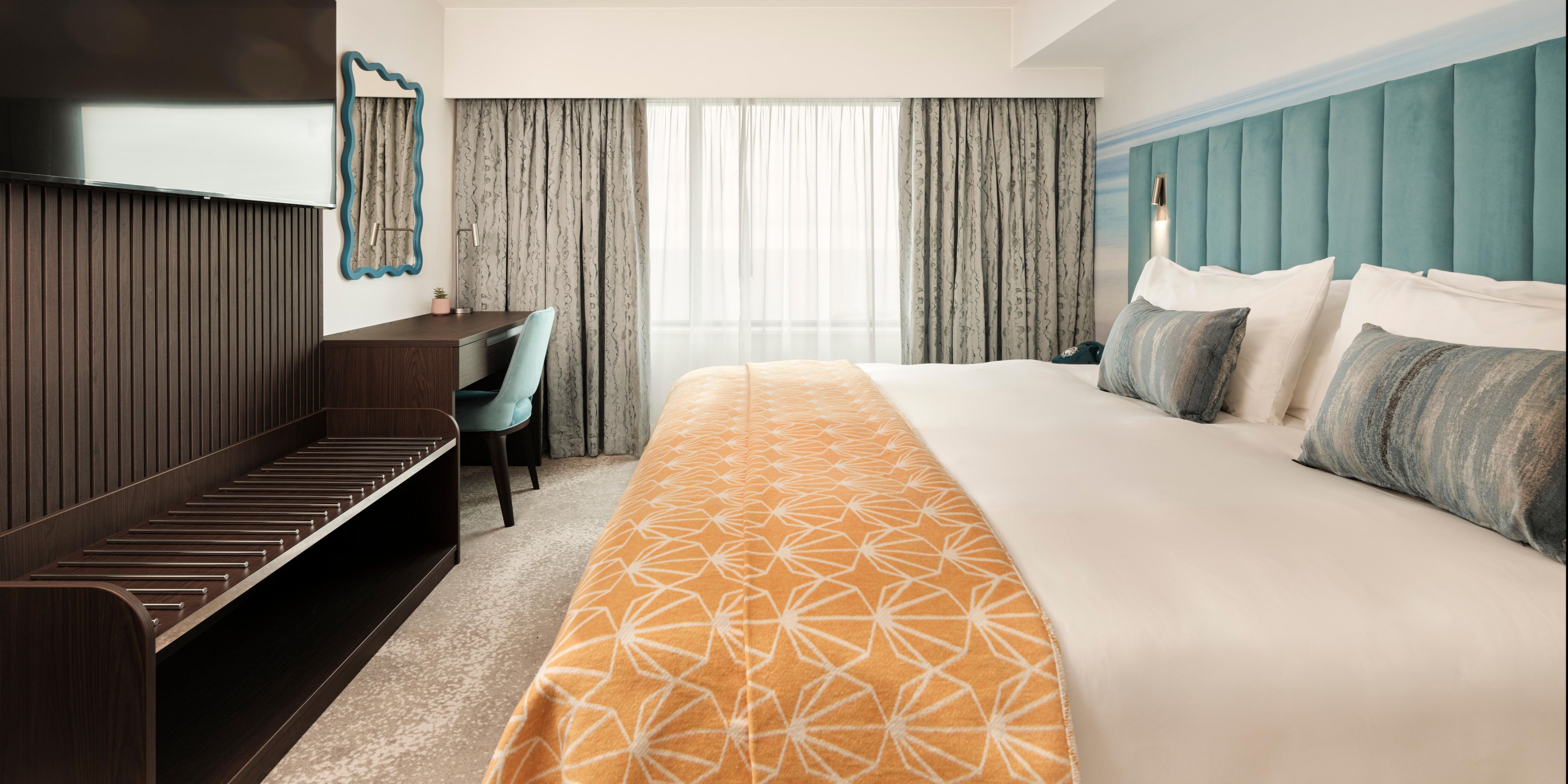 Enjoy a stylish room with calming coastal surroundings.