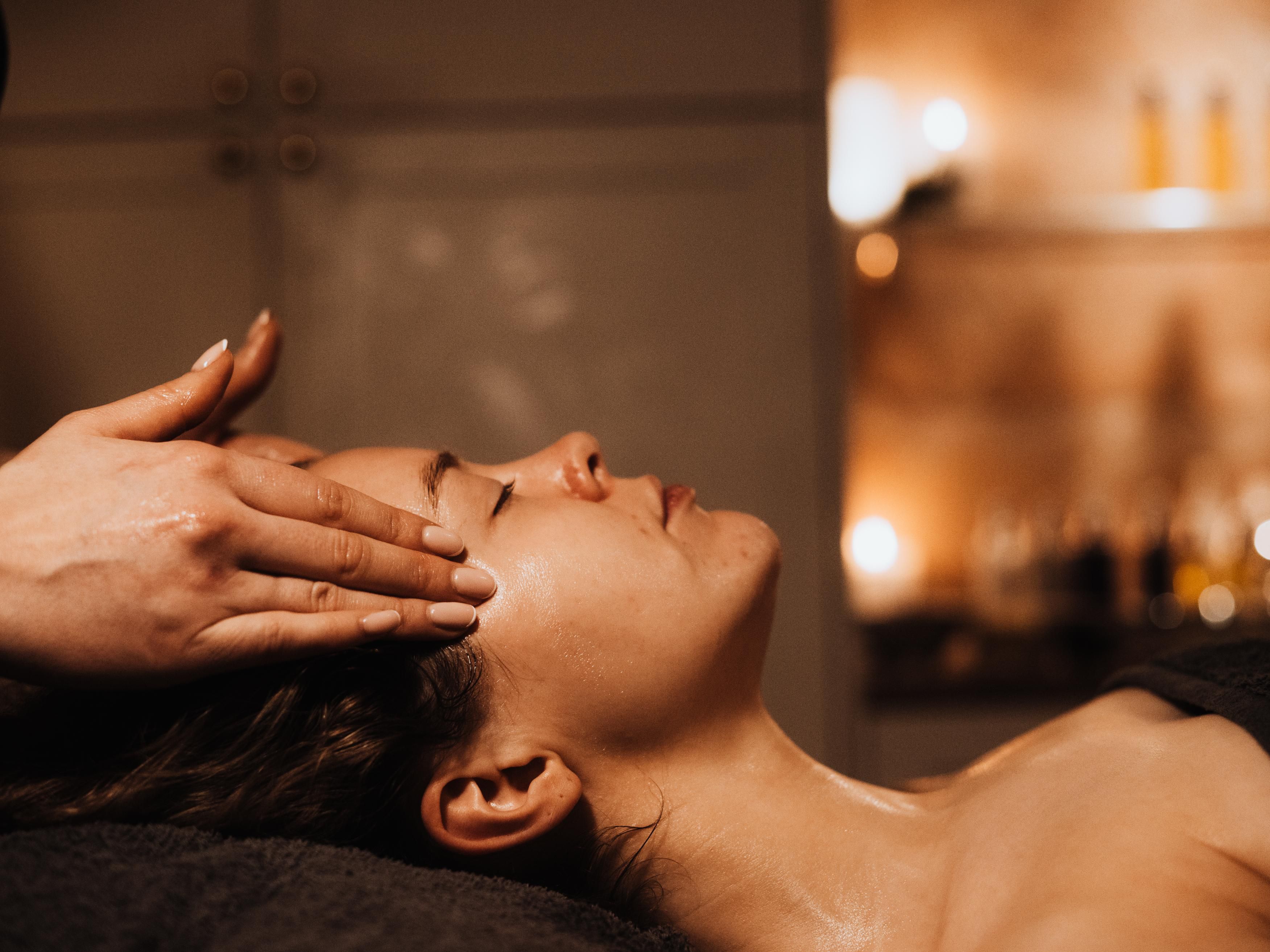 Premium spa oils and massage treatments at The Palm Rooms