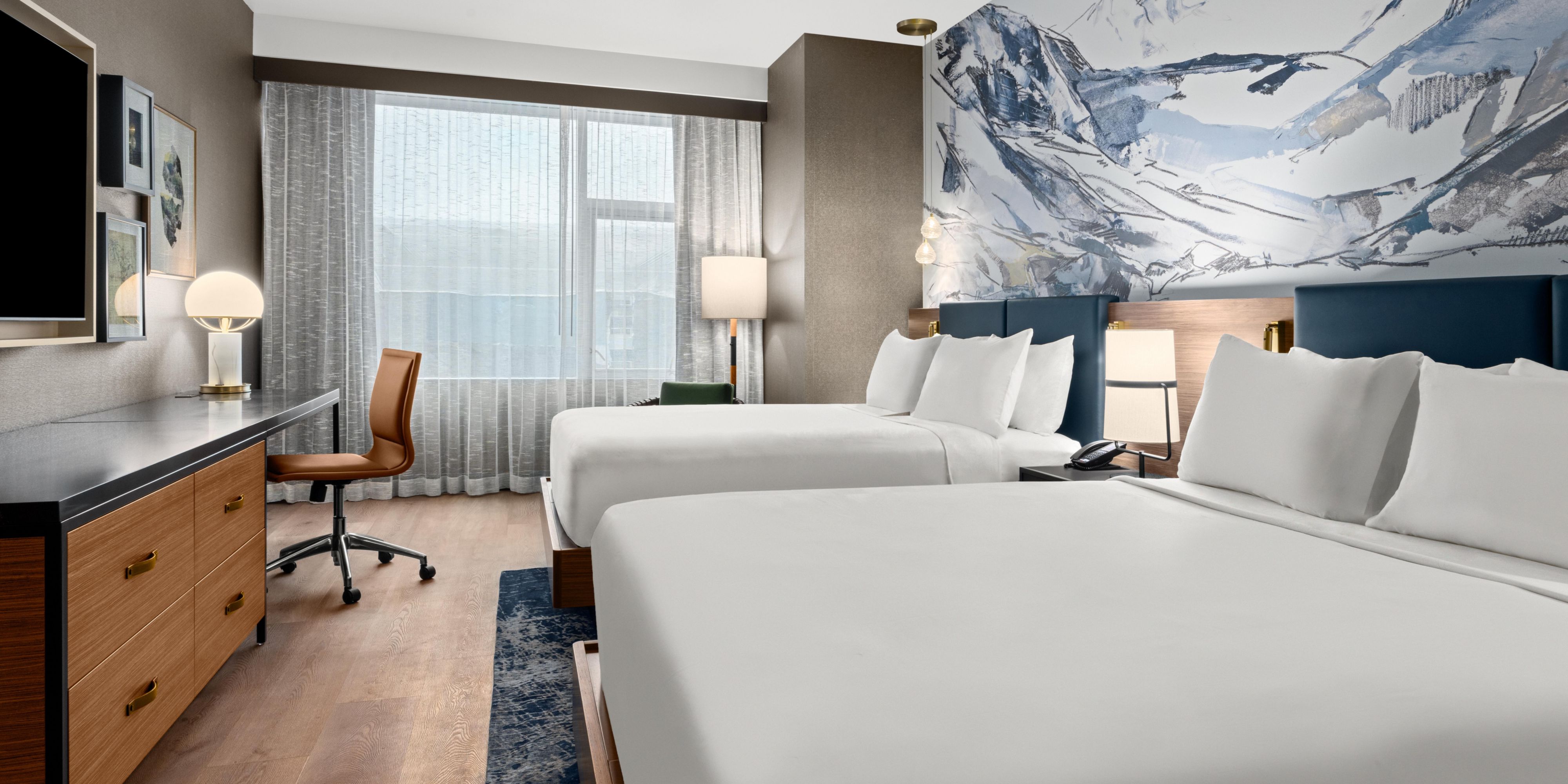 Relax with the whole family in our two-queen guest room.