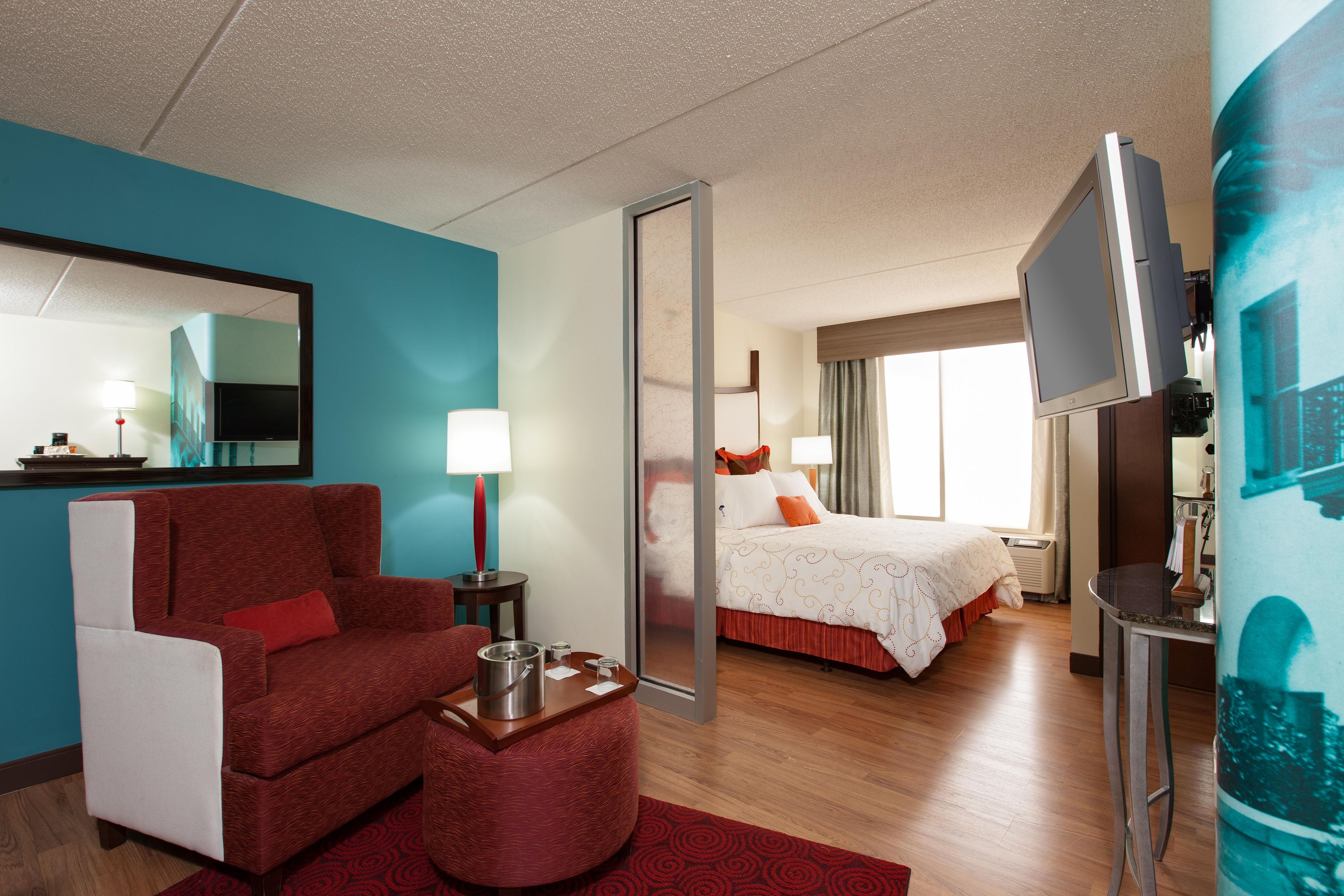 Our oversized guest rooms feature a sitting area, work desk, hardwood floors and mini-refrigerators. 
