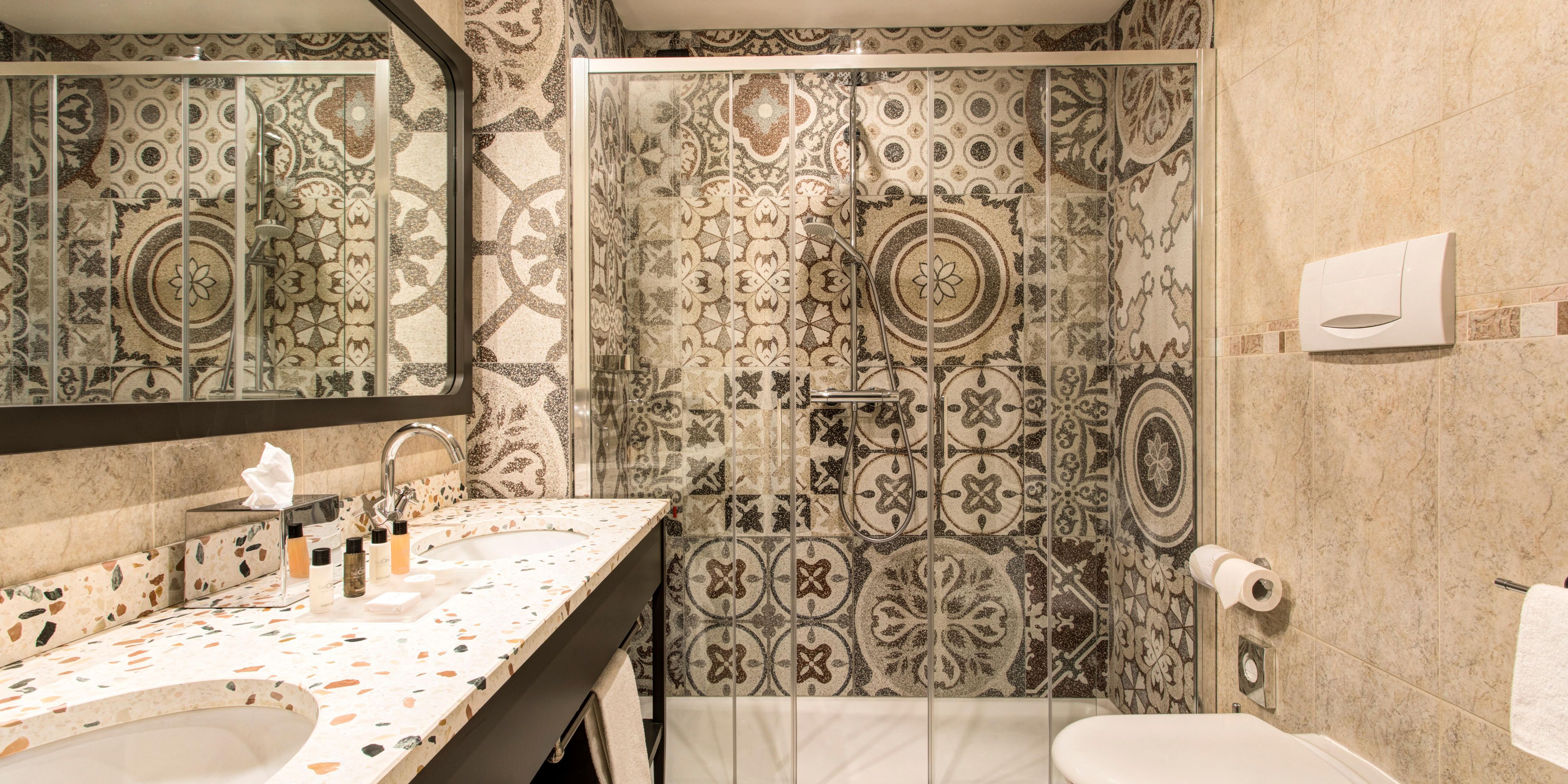 After a day sightseeing, relax in the elegant suite bathroom.