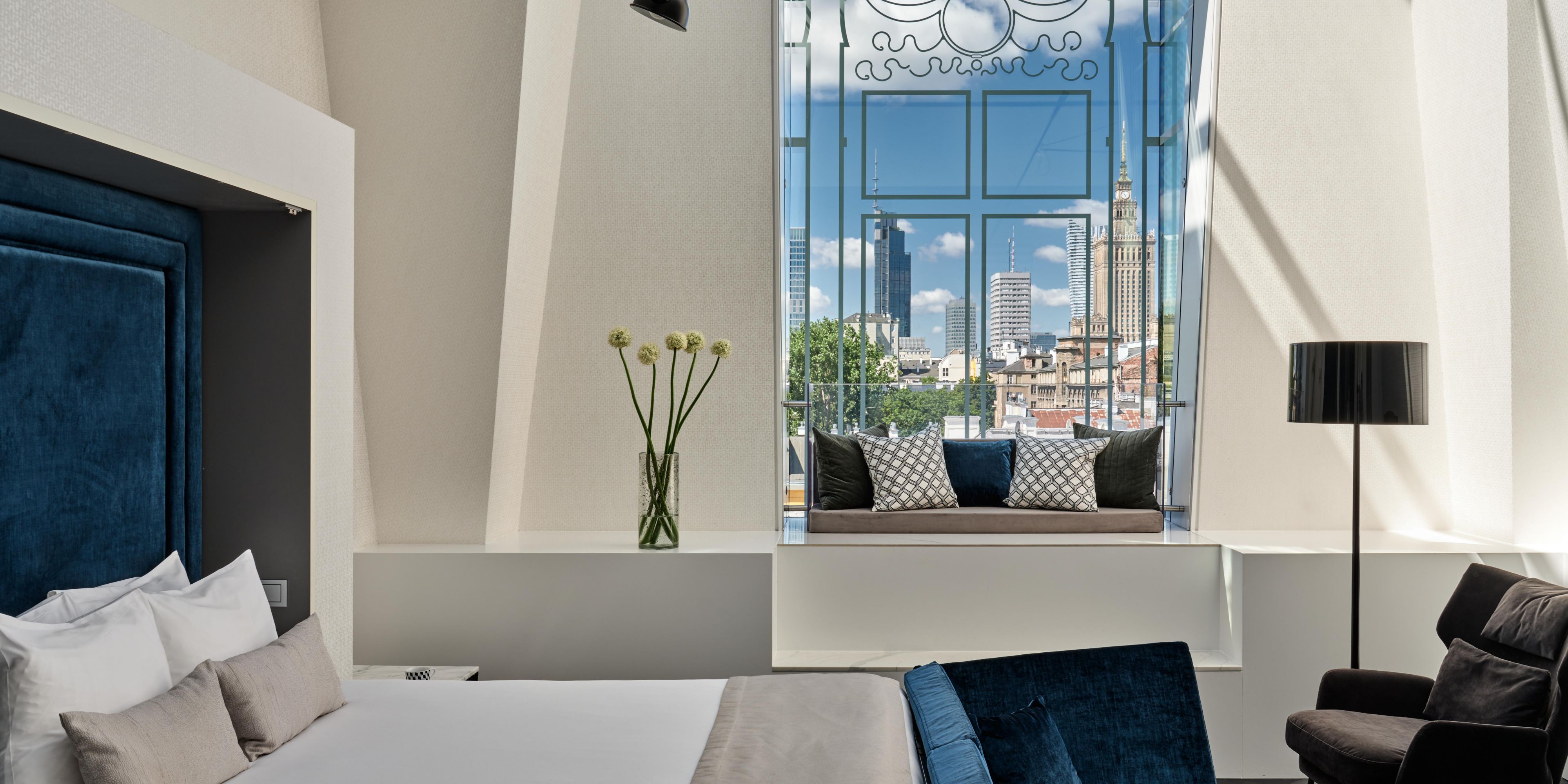 Relax in bed with a stunning view of downtown Warsaw.