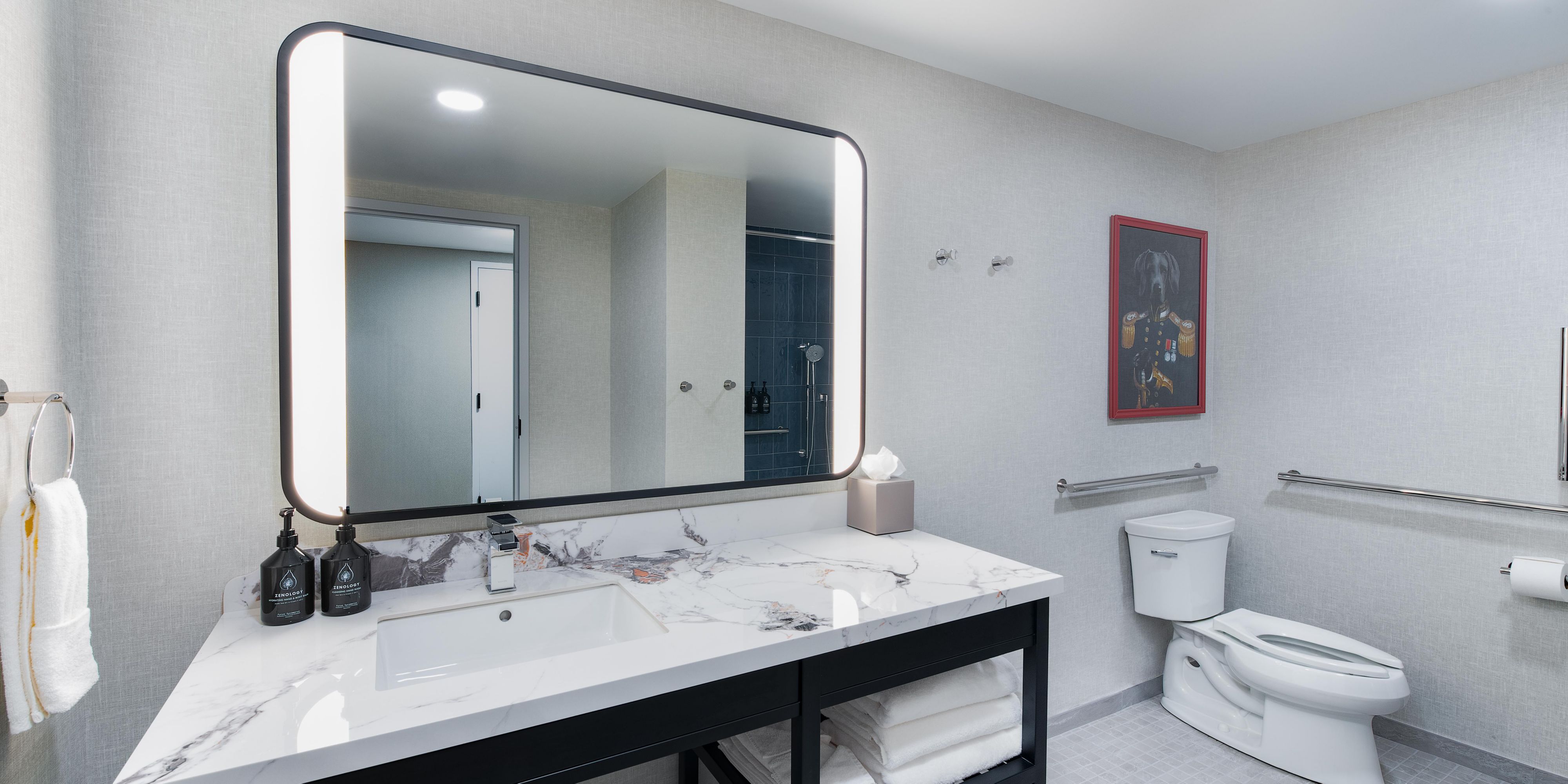 Serene ADA accessible bathrooms with fresh amenities.