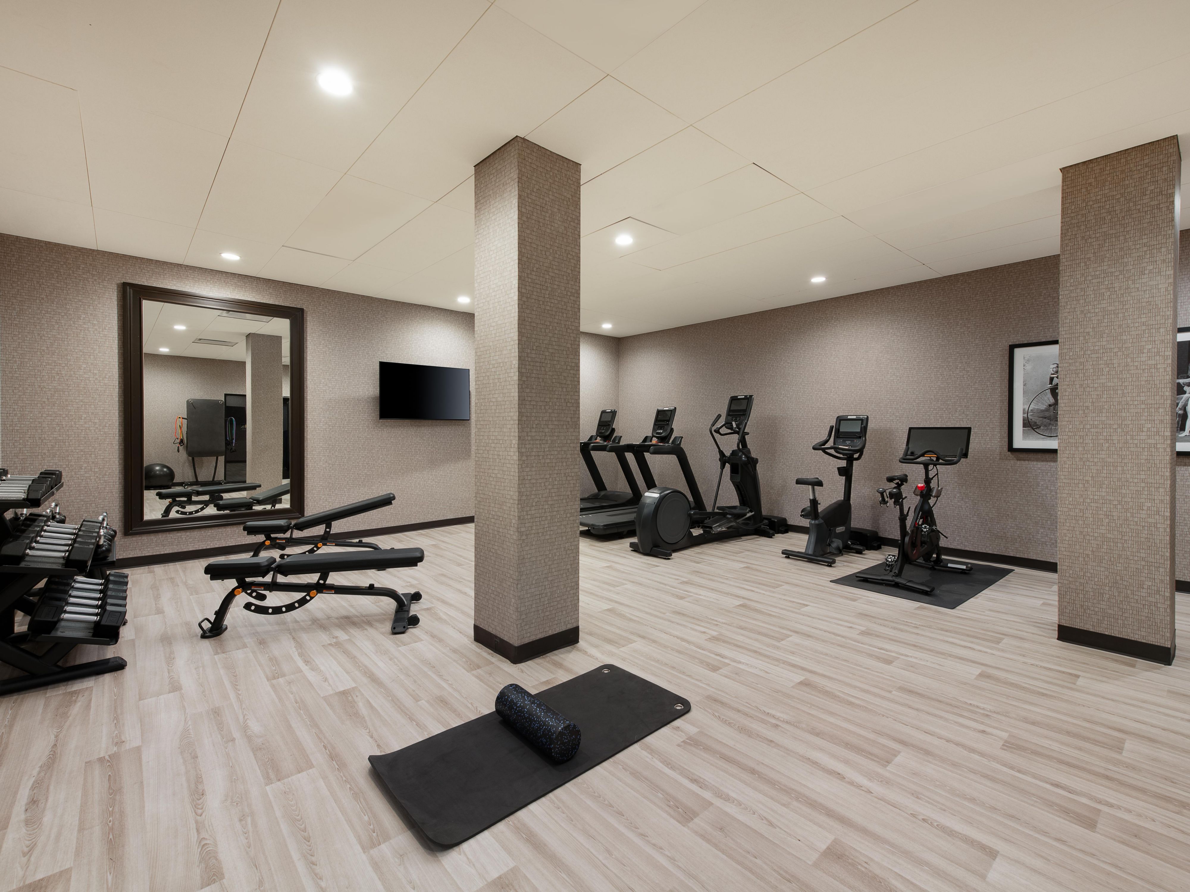 Our fitness room has free weights, treadmills, and a  Peloton bike