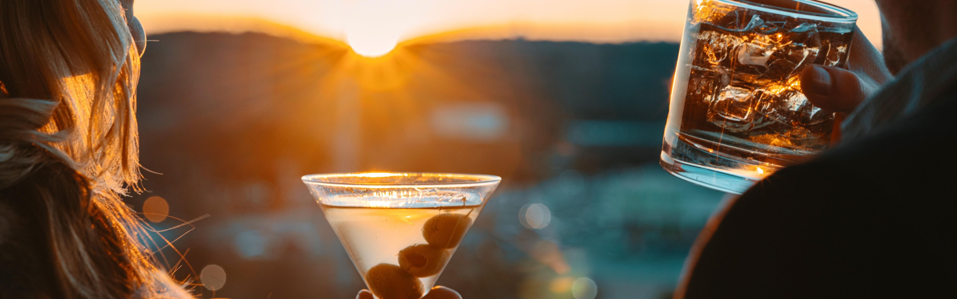 Drinking cocktails in sunset