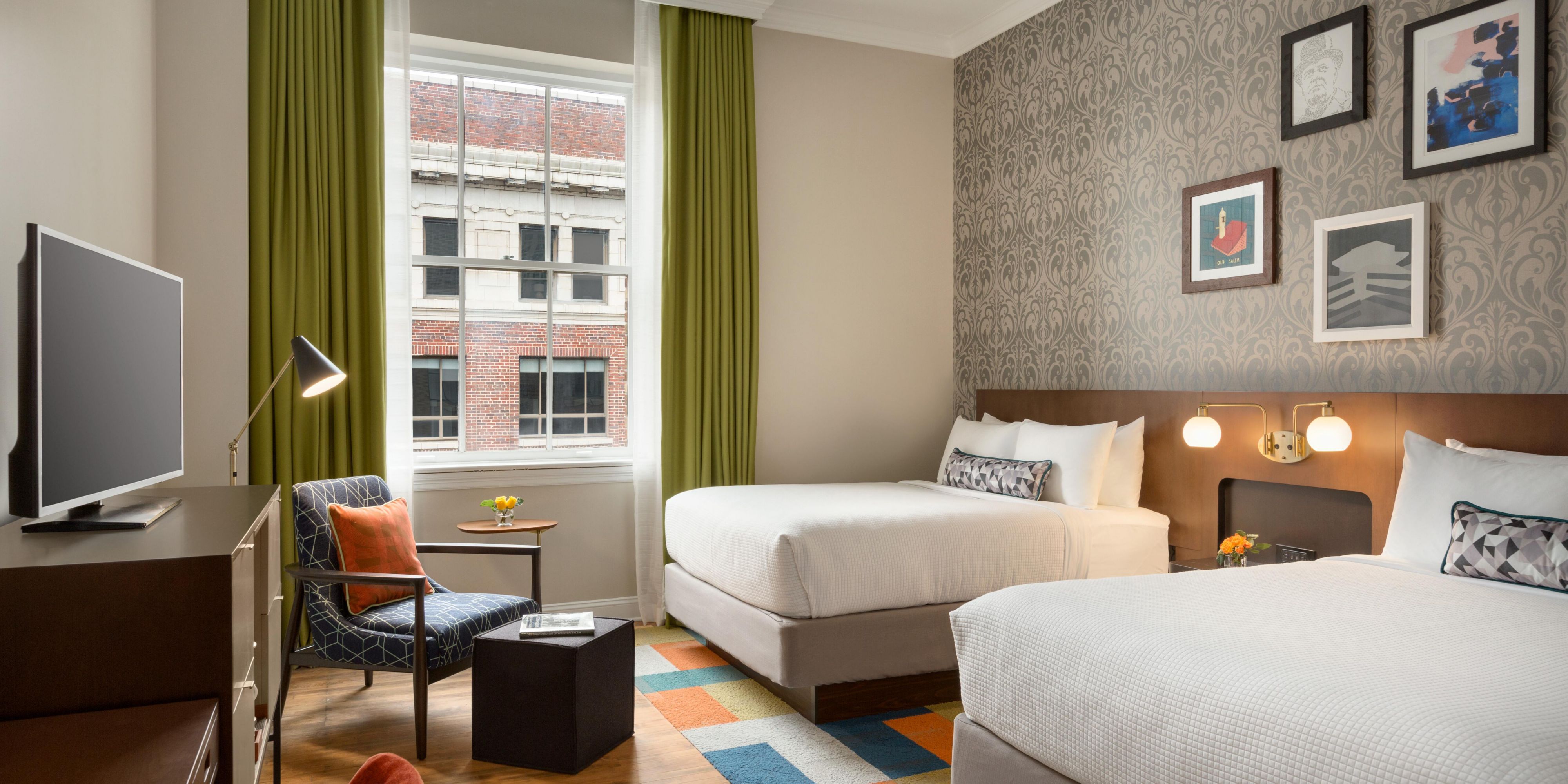 Double Queen Guest Room - Free Wi-Fi and Aveda bath amenities.