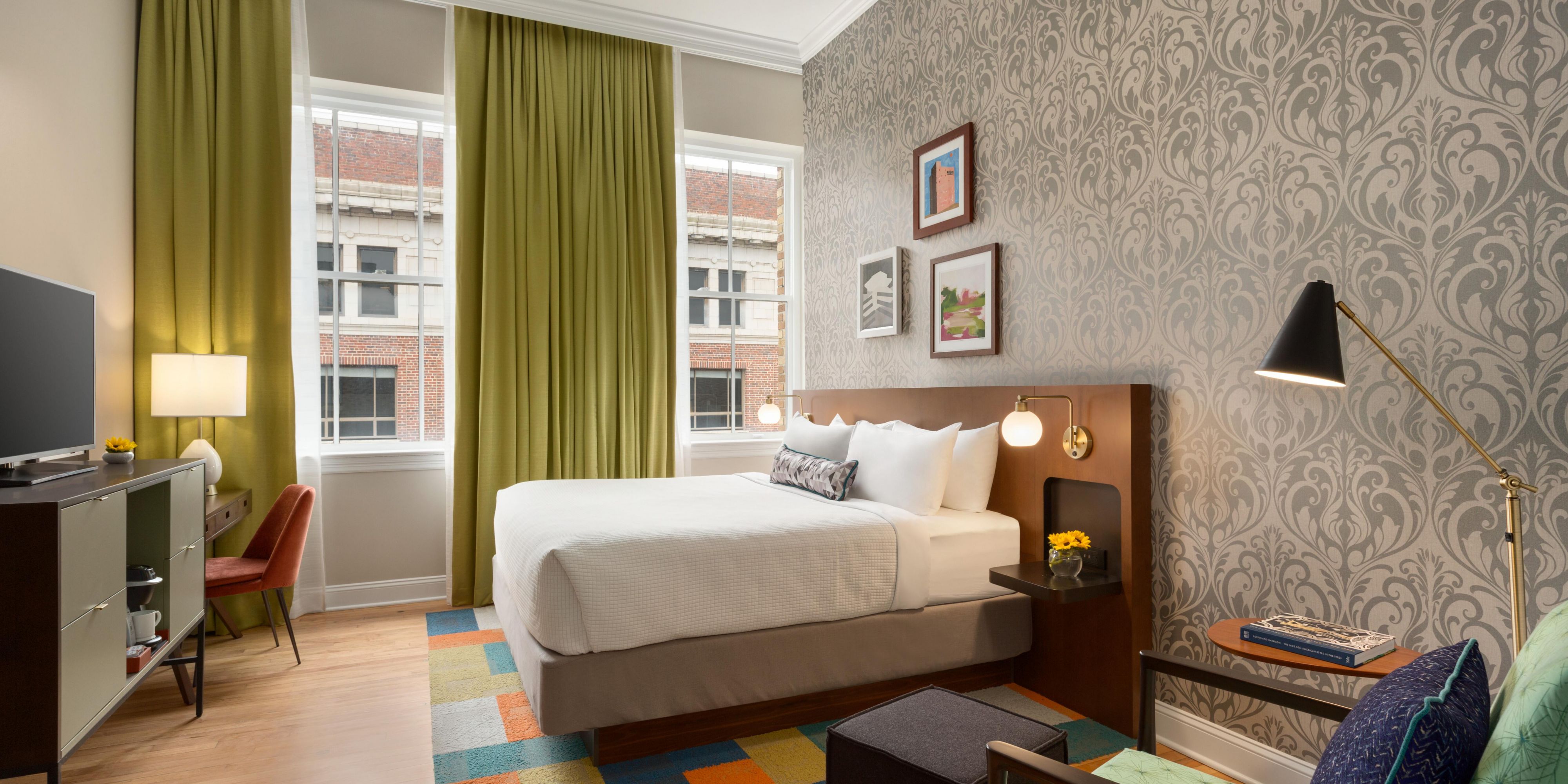 King Guest Room - Featuring plush bedding and spa-inspired shower.