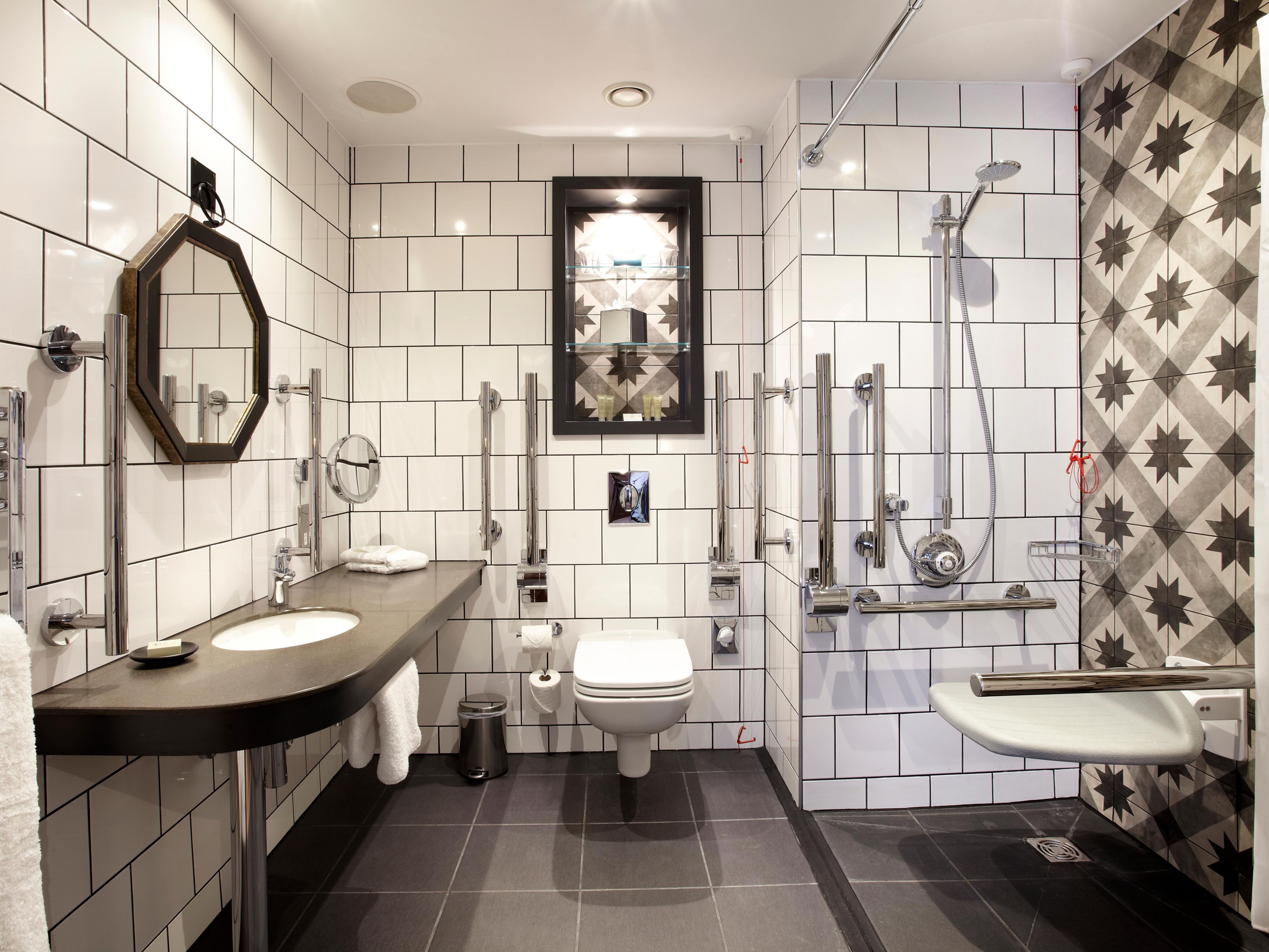 Bathrooms in Accessible rooms have roll in shower and grab rails 