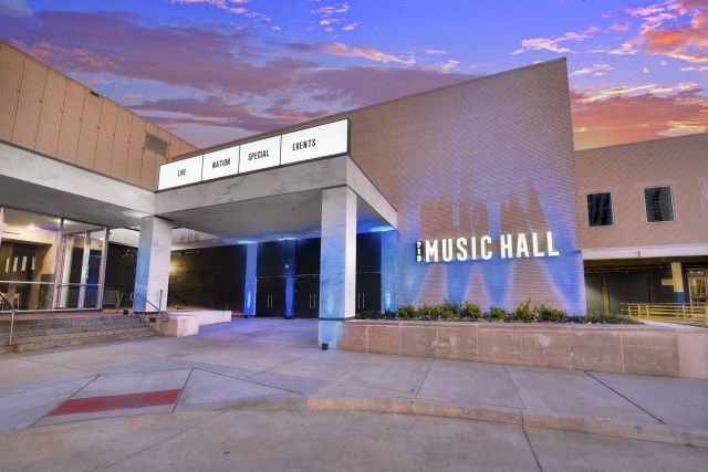 Exterior of 713 Music Hall at dusk in downtown Houston