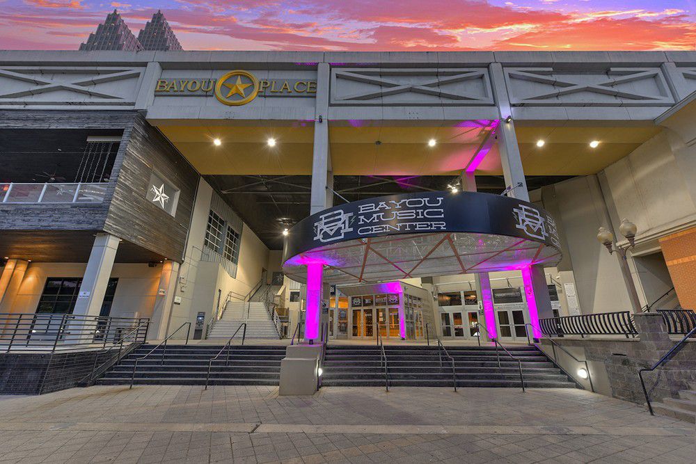 Entrance to Bayou Music Center illuminated at sunset