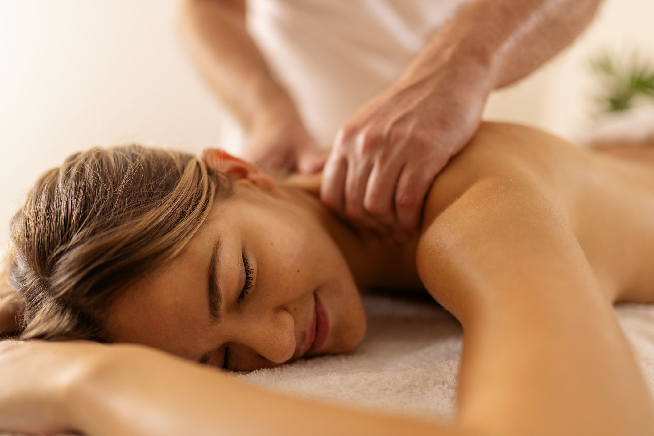 Massage therapist with client