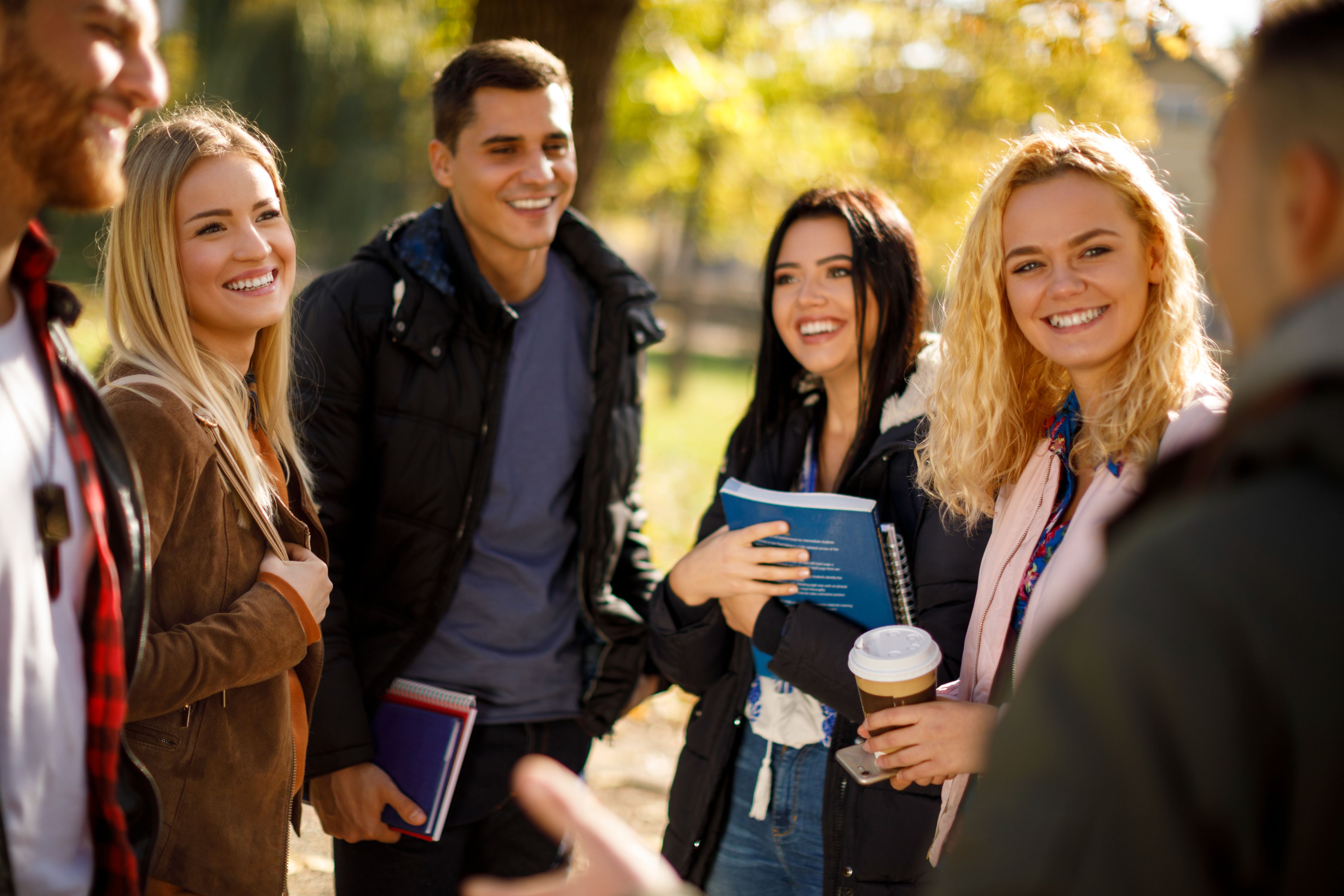 college kids talking on a campus
