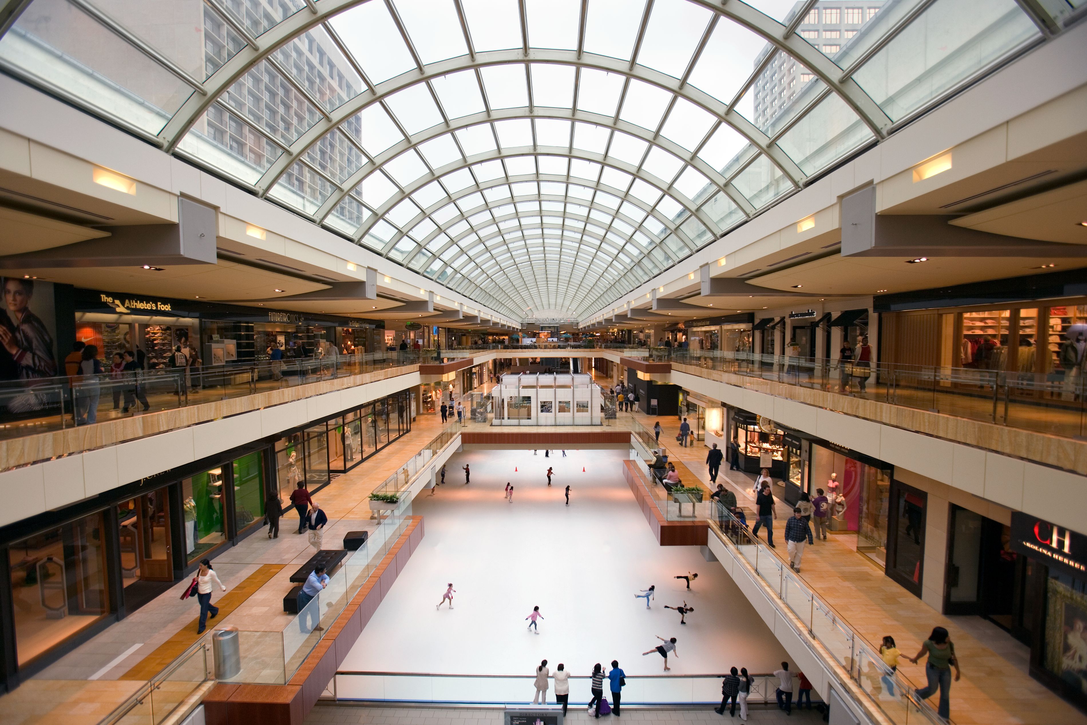interior of The Galleria mall with an ice skating rink and shops.