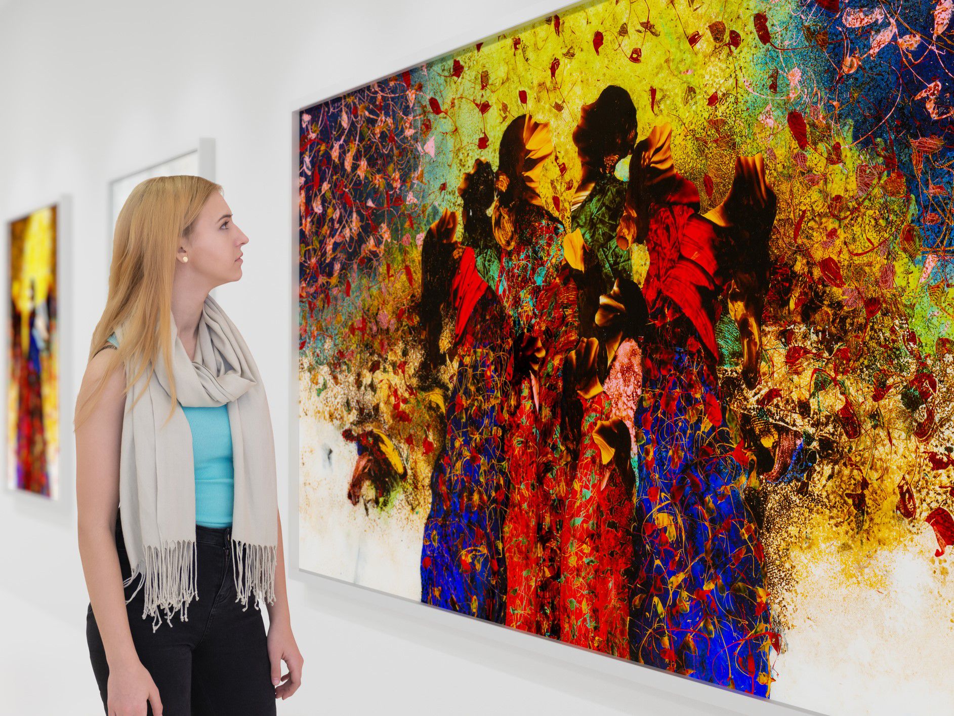 Young woman looking at art in an art museum