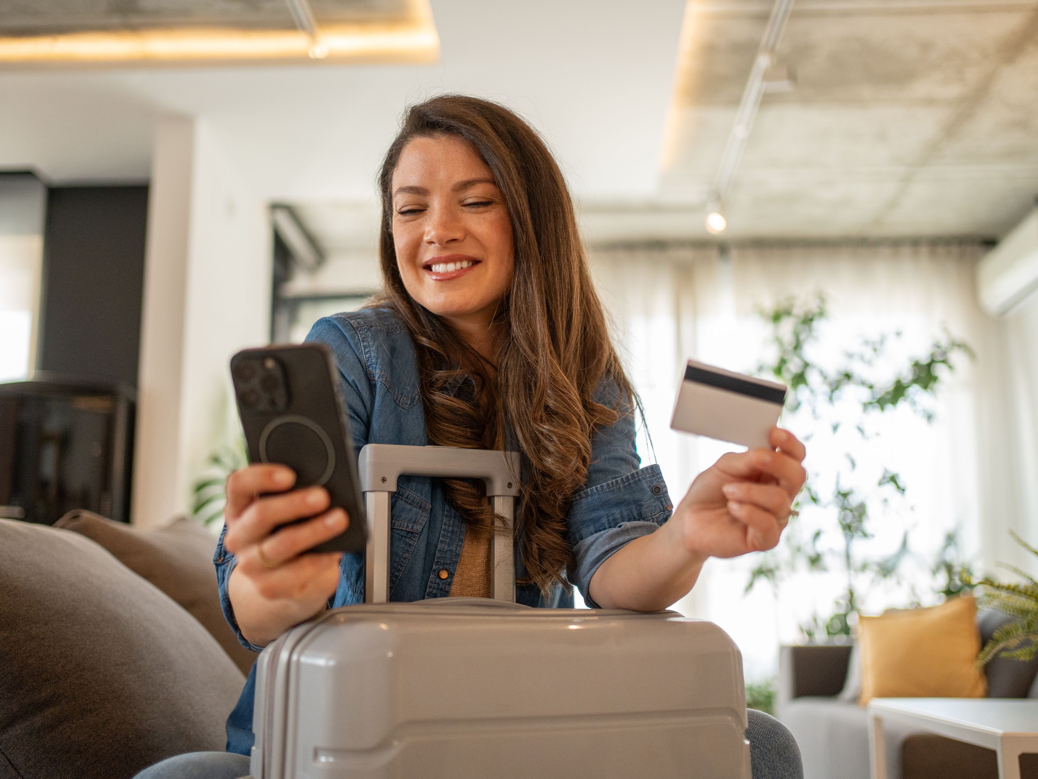 Guest smiling at her phone
