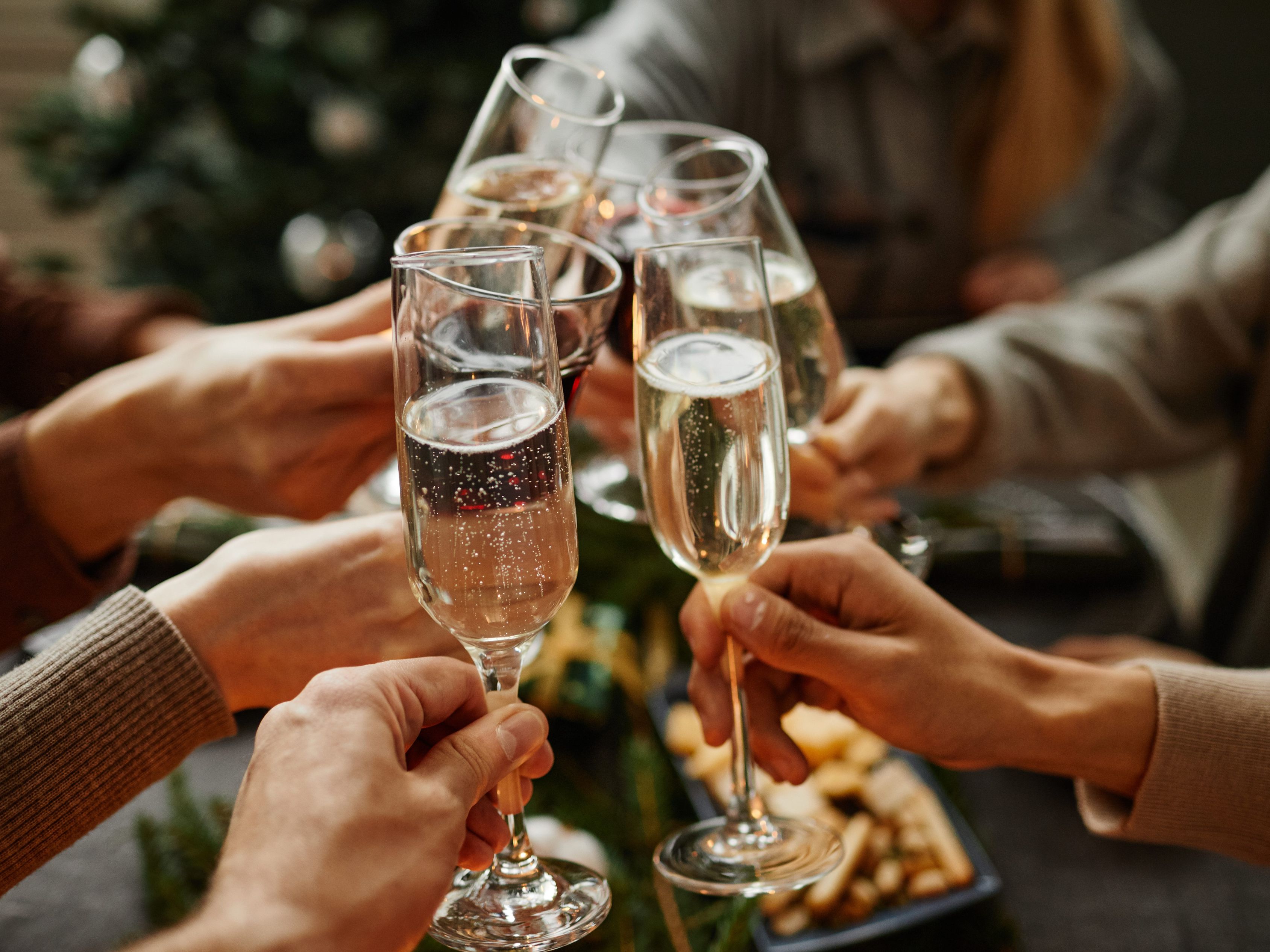 People toasting with champagne at holiday event