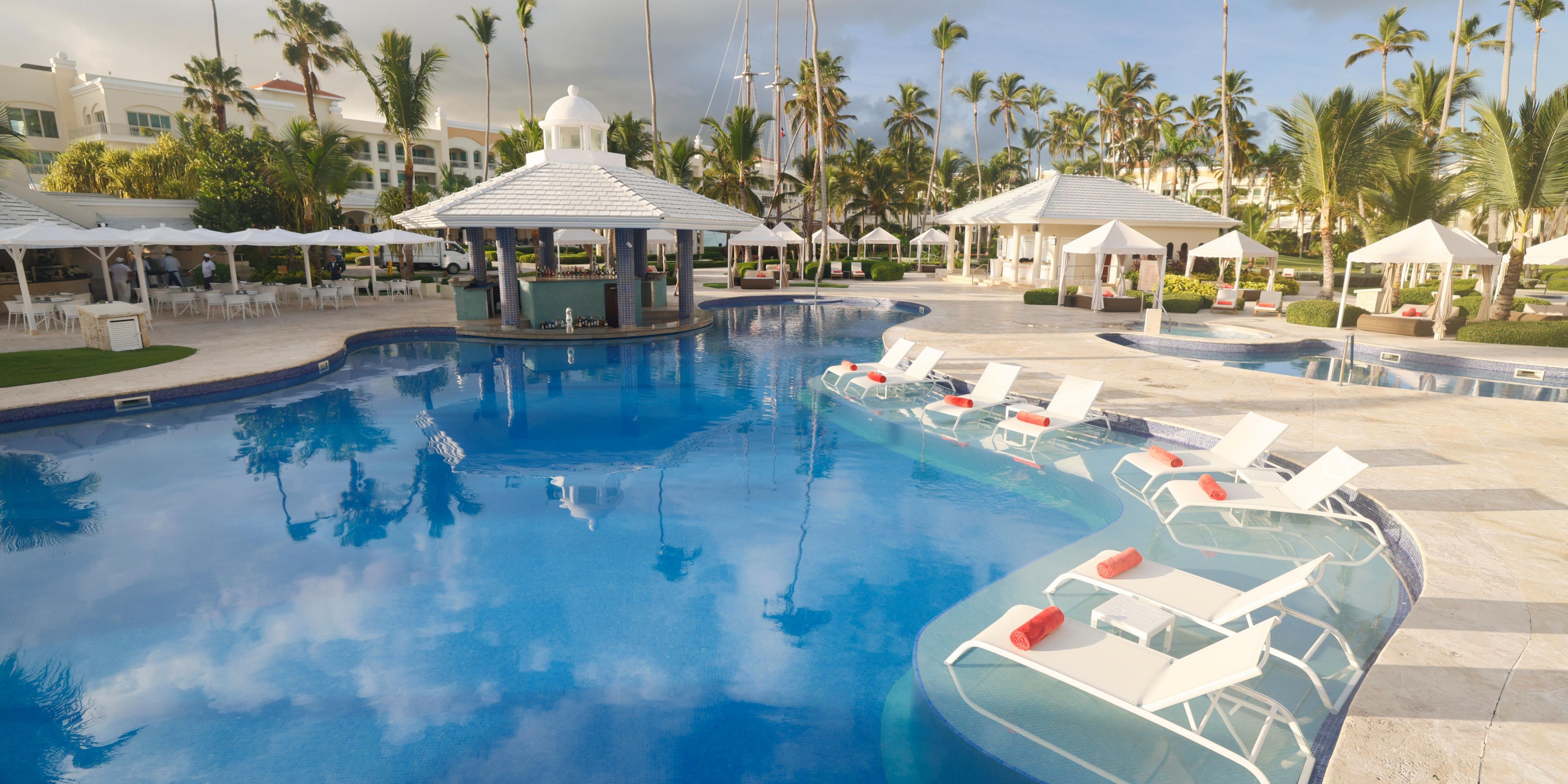 Take a refreshing dip in one of three shimmering pools or stroll the palm-fringed shore of Bávaro Beach. Whether you’re lounging under the sun, diving into water sports, or catching live music, the spirit of the island is never far away.