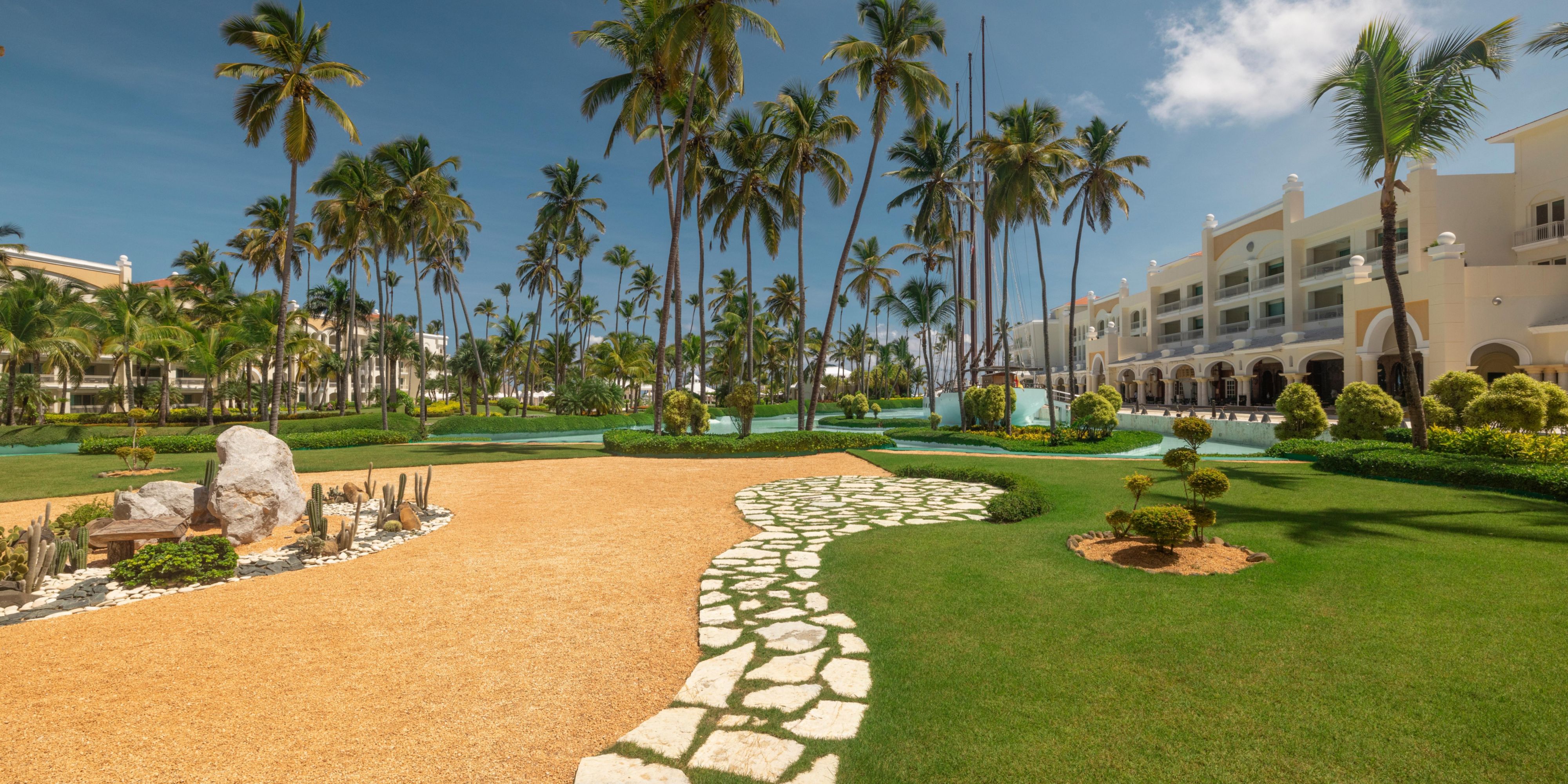 Play through tropical beauty at the Iberostar Bávaro Golf Club, a par-72 course designed by P.B. Dye. Surrounded by lakes, native gardens, and ocean breezes. This 18-hole course offers scenic challenges and lush fairways that make every round feel like paradise.