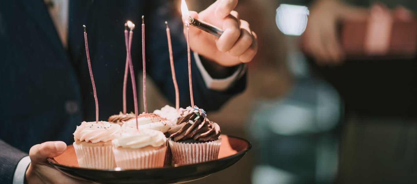 cupcakes with candles being lit