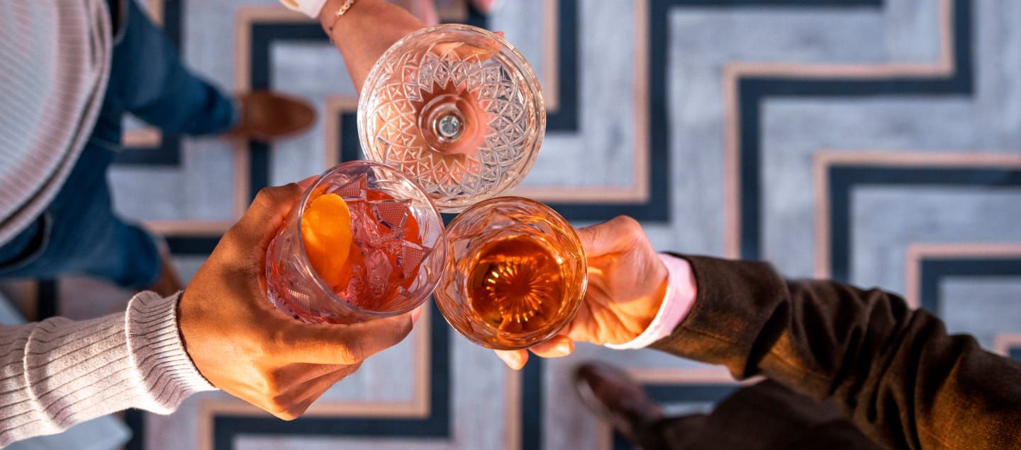 people making a toast with rose