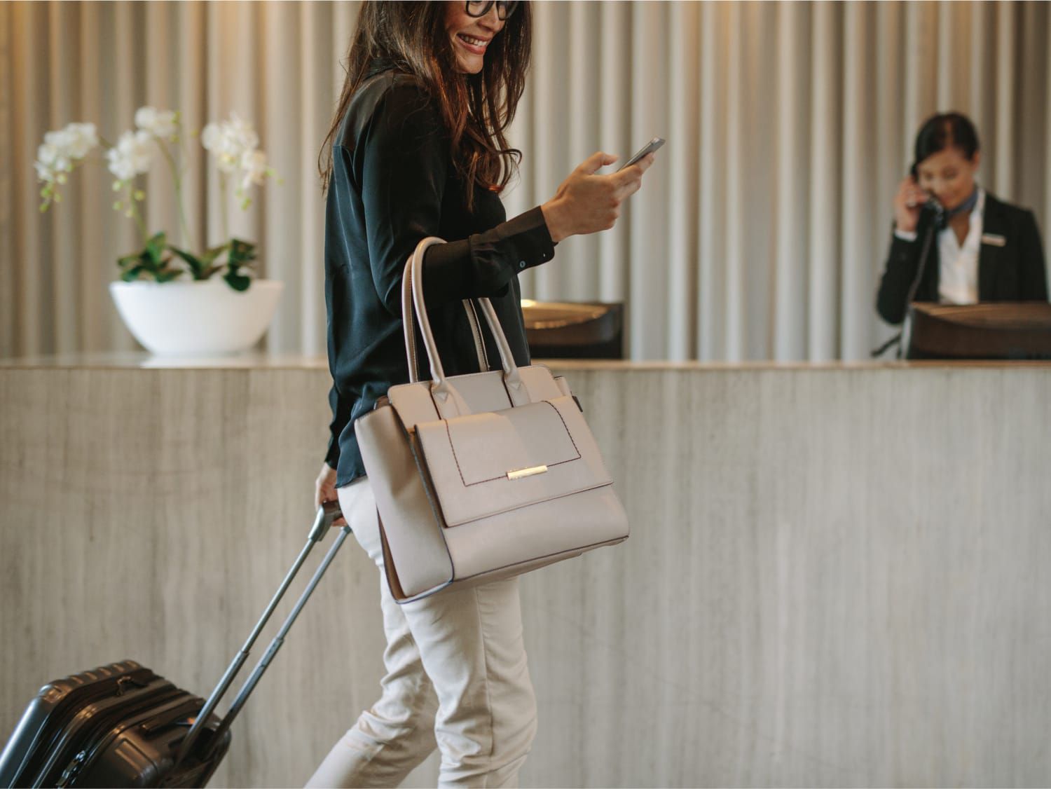 Woman walking through lobby