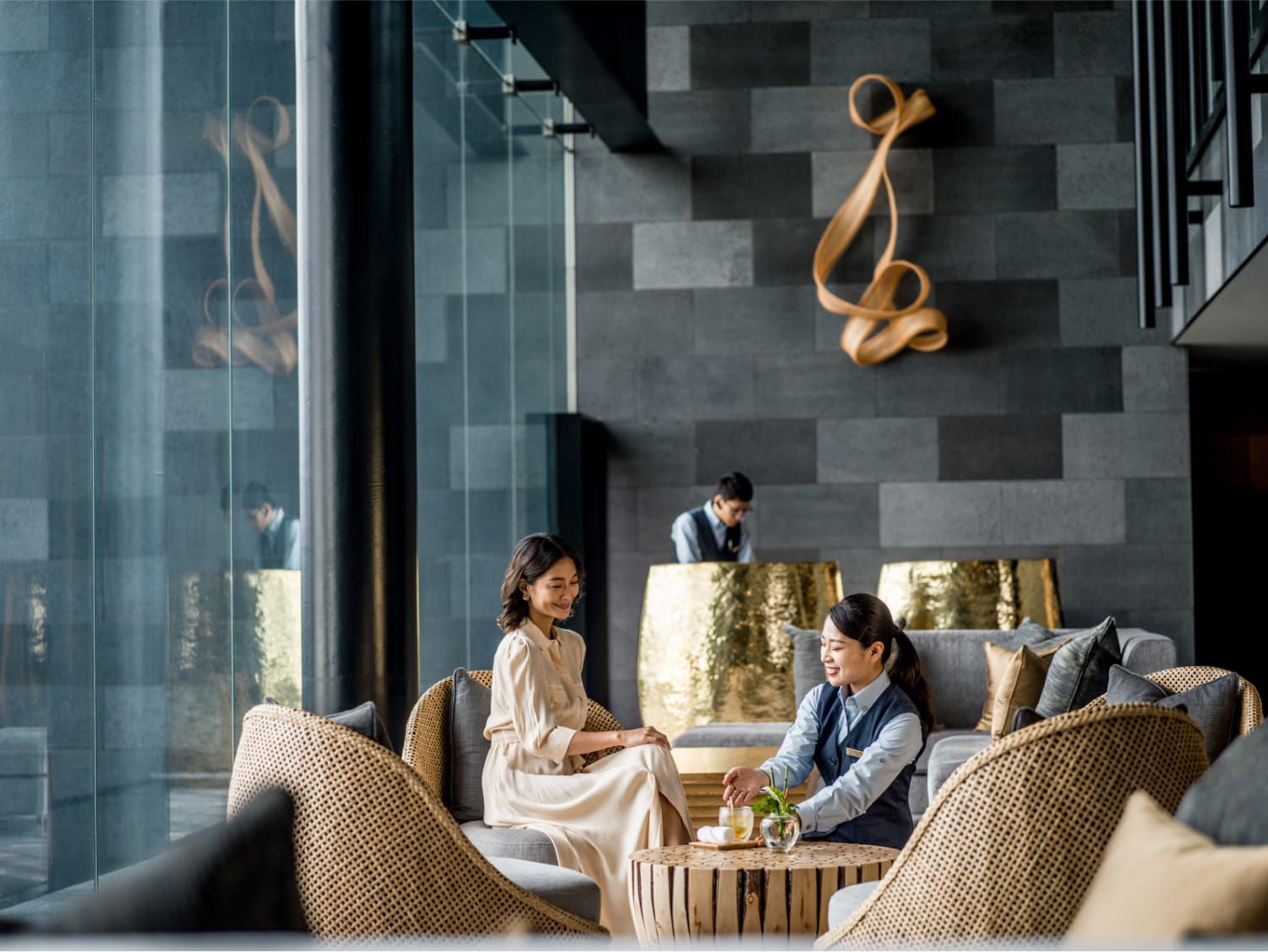 people sitting in conversation in a lobby