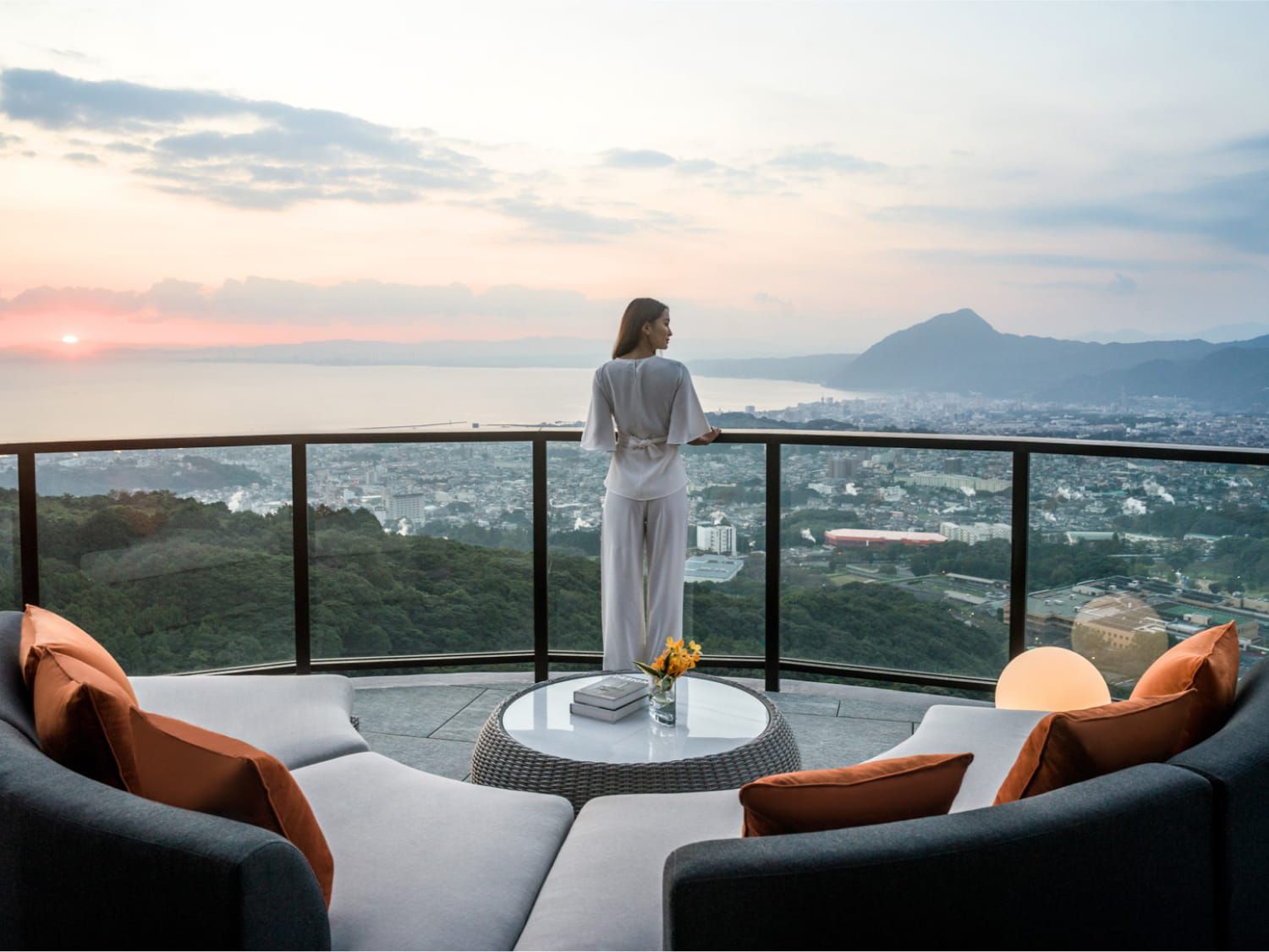 woman overlooking incredible mountain and ocean veiws