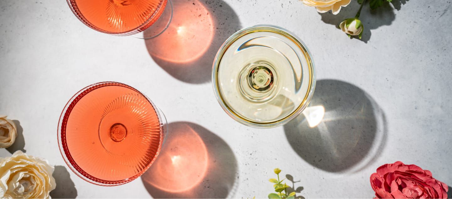 overhead view of rose, white wines in stemware