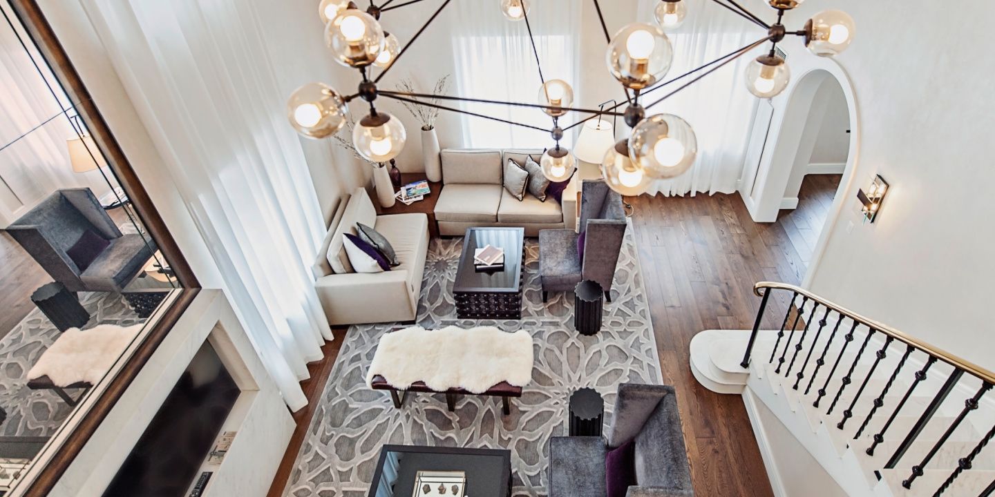 overhead view of a suite sitting area with couches and gray and white decor