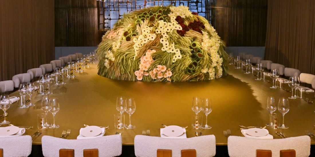 A giant floral globe adorns the Incredible Occasion dinner party tablescape.
