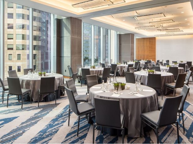 Round tables and chairs set for a social event in our Roosevelt Multi-Purpose room