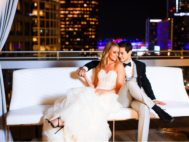 Bride and groom sitting on the rooftop of our Los Angeles wedding venue
