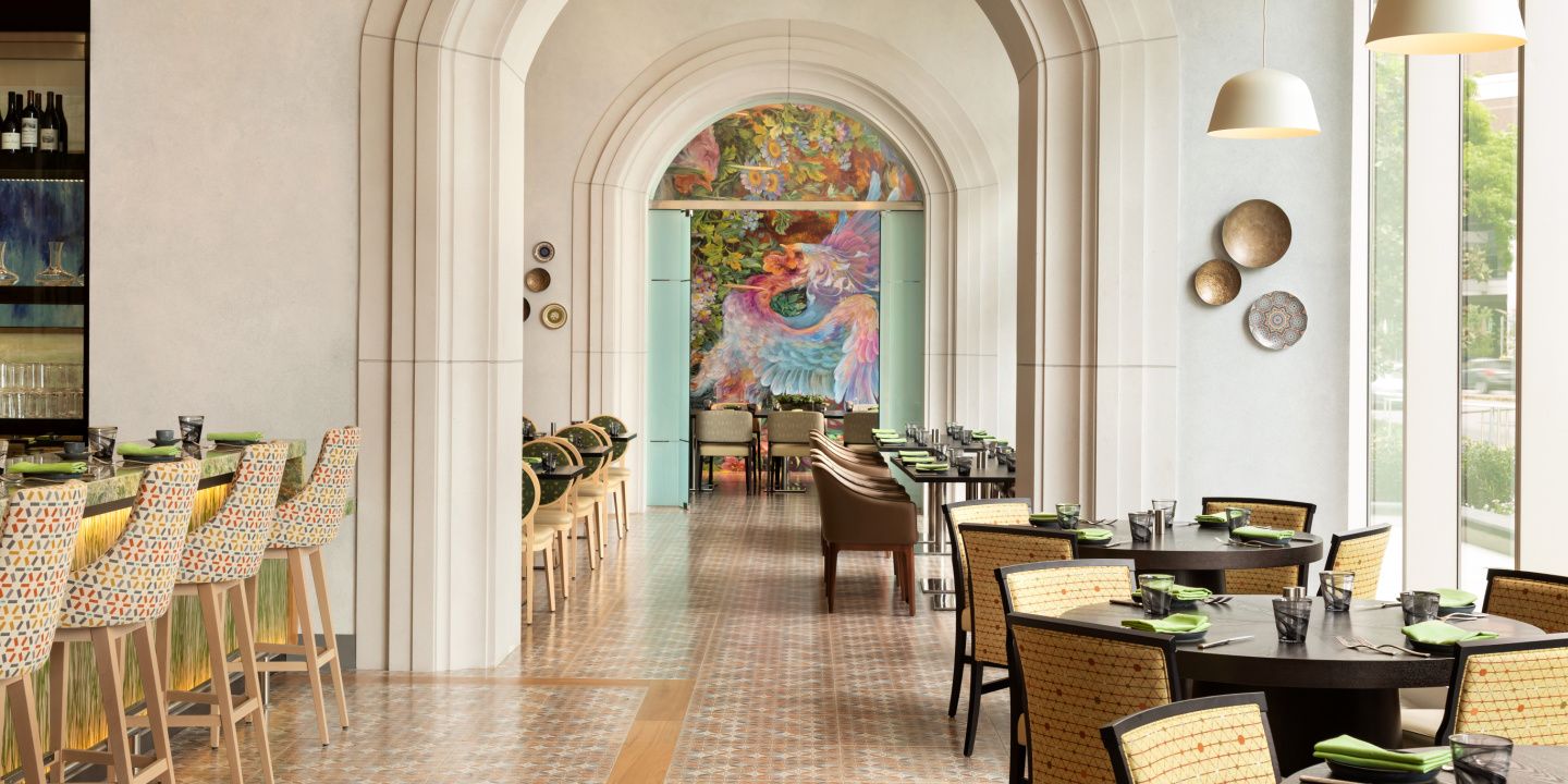 arched entrances to a restaurant and bar with beautiful artwork