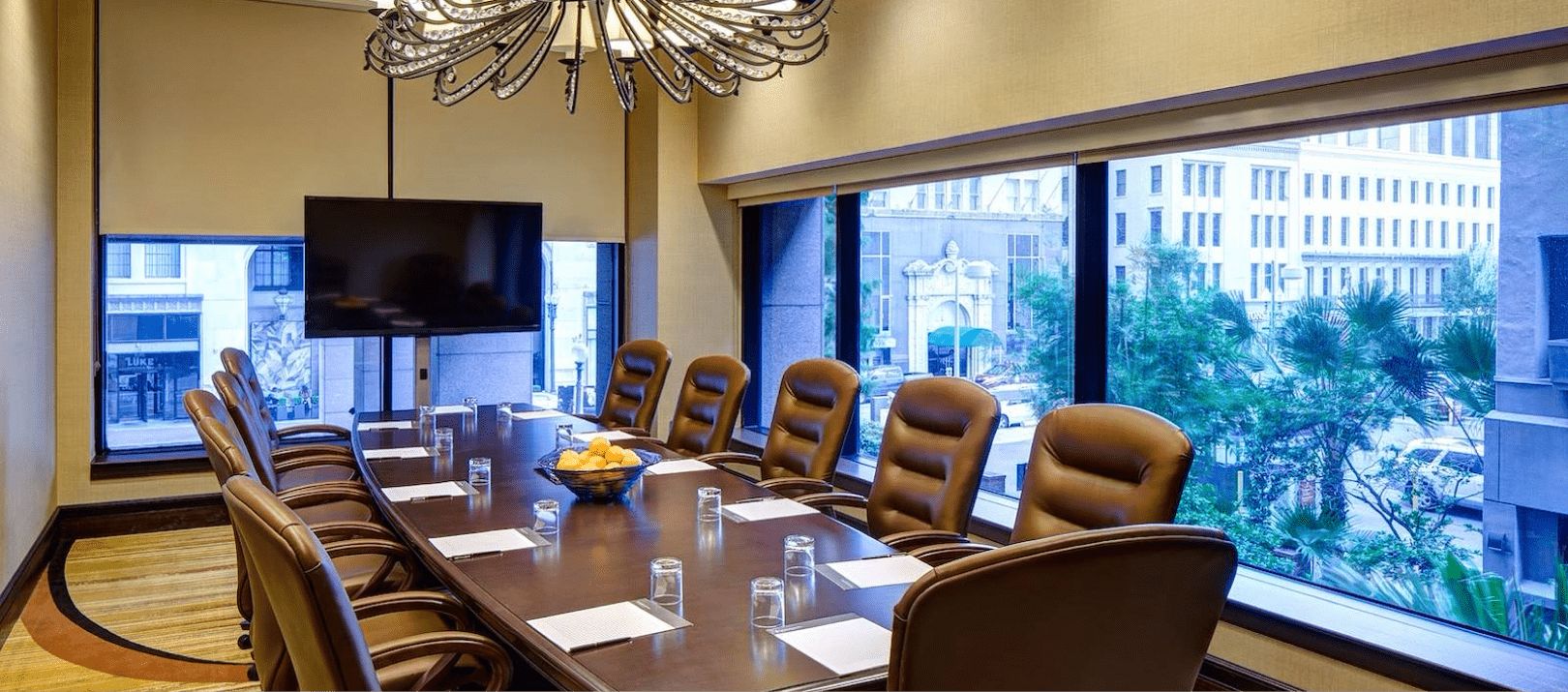 Boardroom with brown table and office chairs