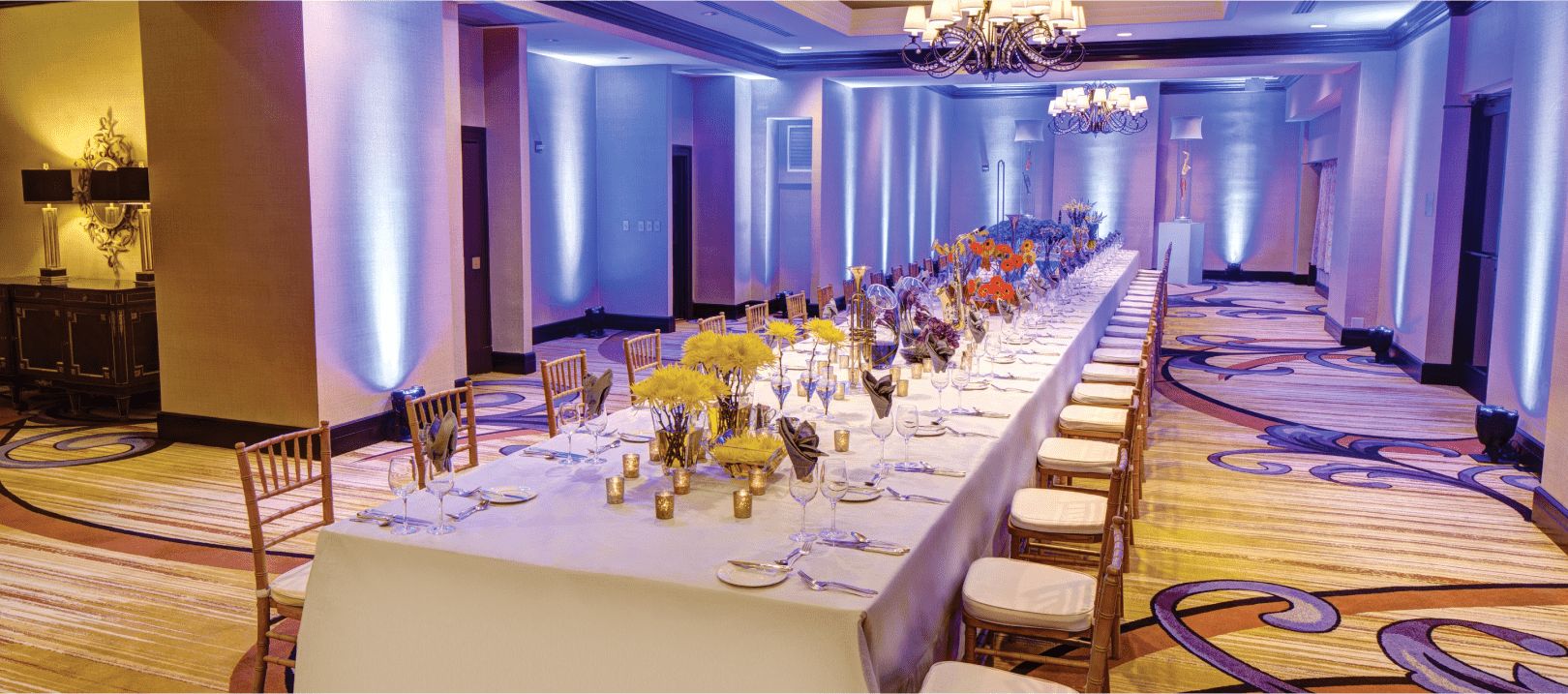 Long table set for rehearsal dinner 