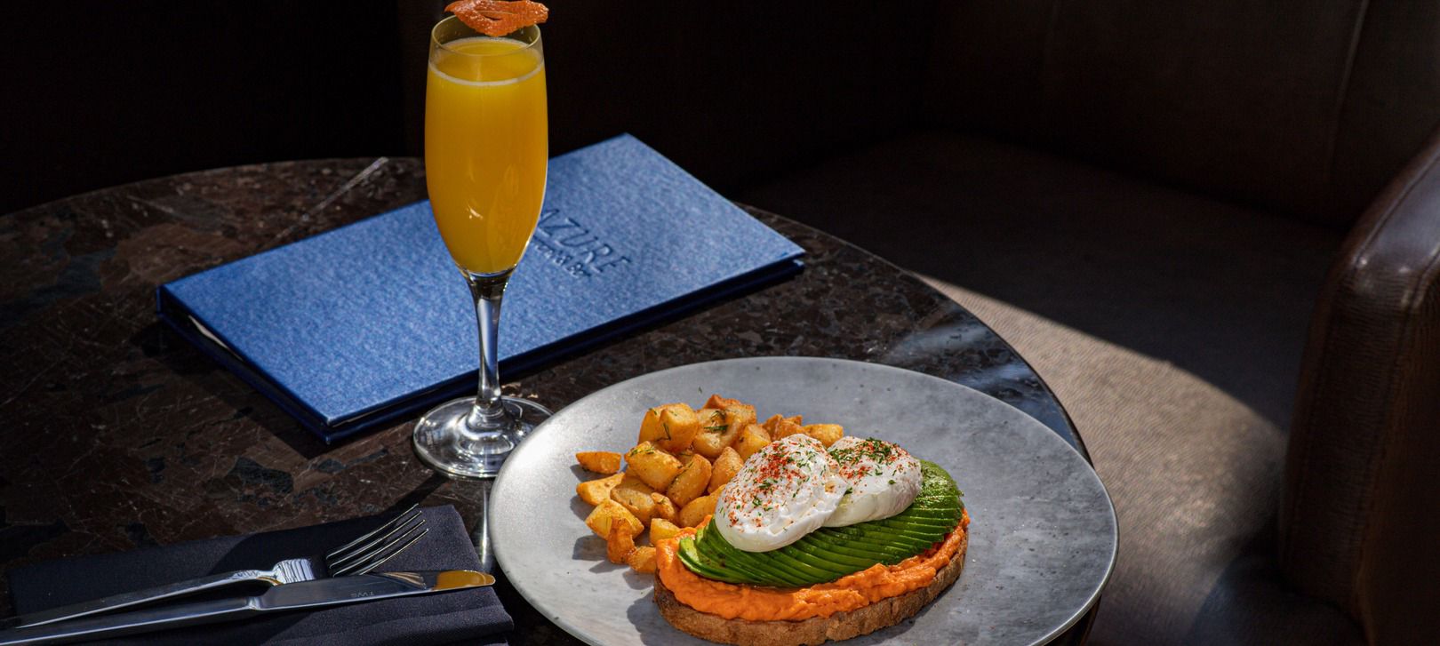 Enjoy eggs benedict, potatoes and fresh coffee for breakfast at Azure Restaurant
