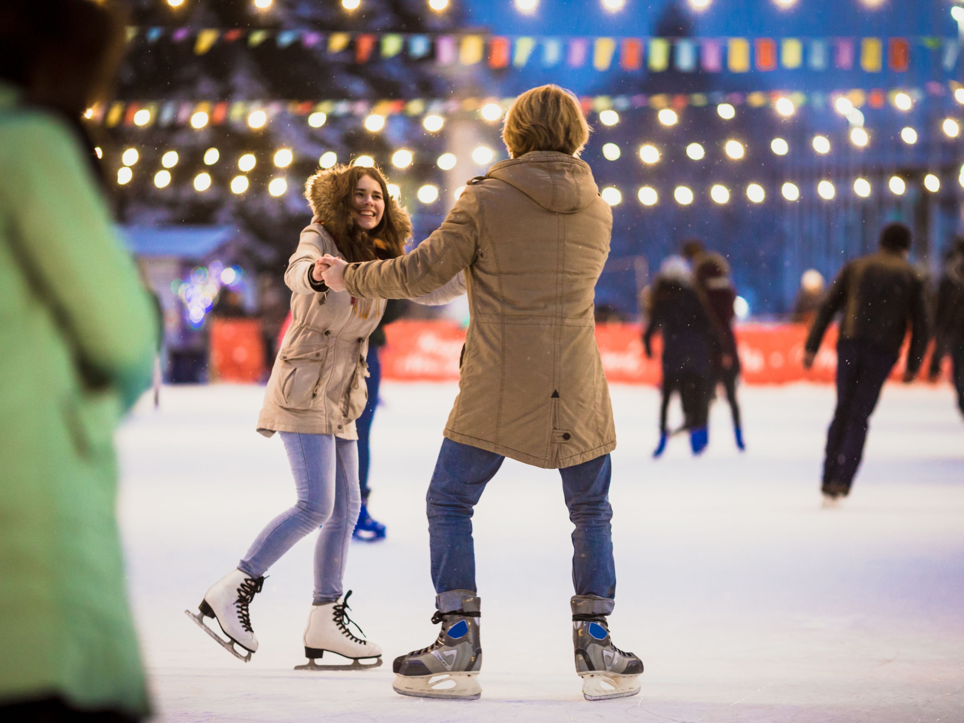 Ice skating outdoors under lights