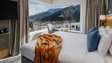Corner bedroom overlooking the town and sweeping views of the Remarkables mountain range