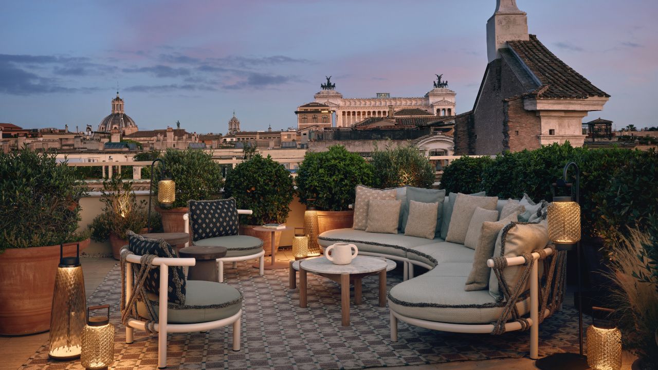 rooftop terrance in rome with candles at dusk
