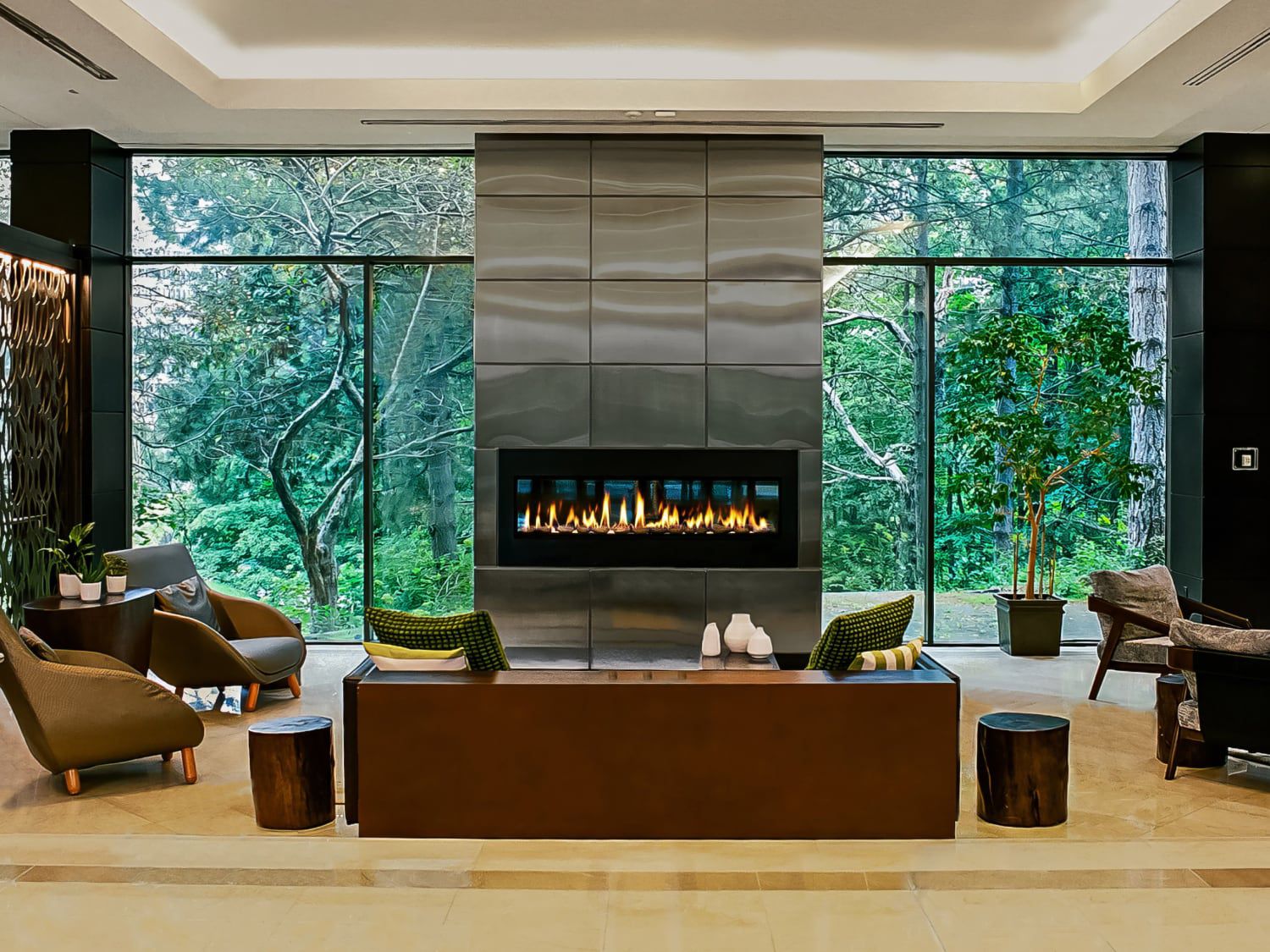 Modern hotel lobby with fireplace and lounge seating