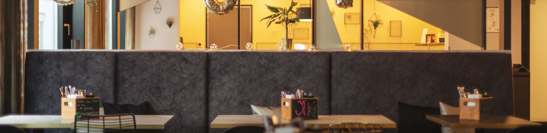 Hotel restaurant with booth seating and modern décor