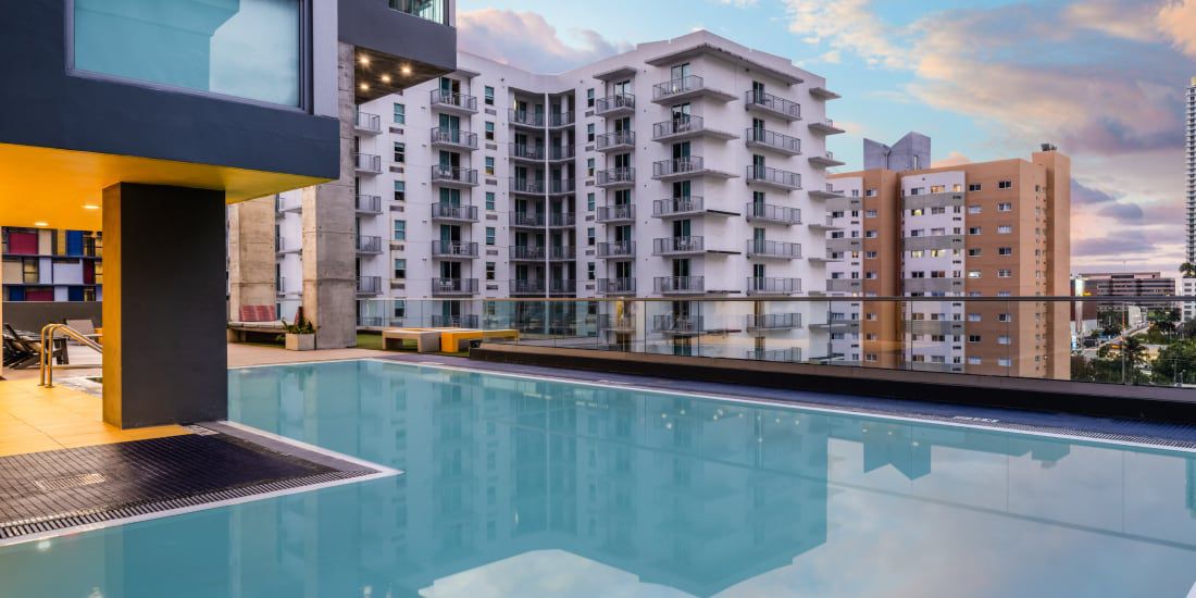Outdoor hotel pool overlooking an urban skyline