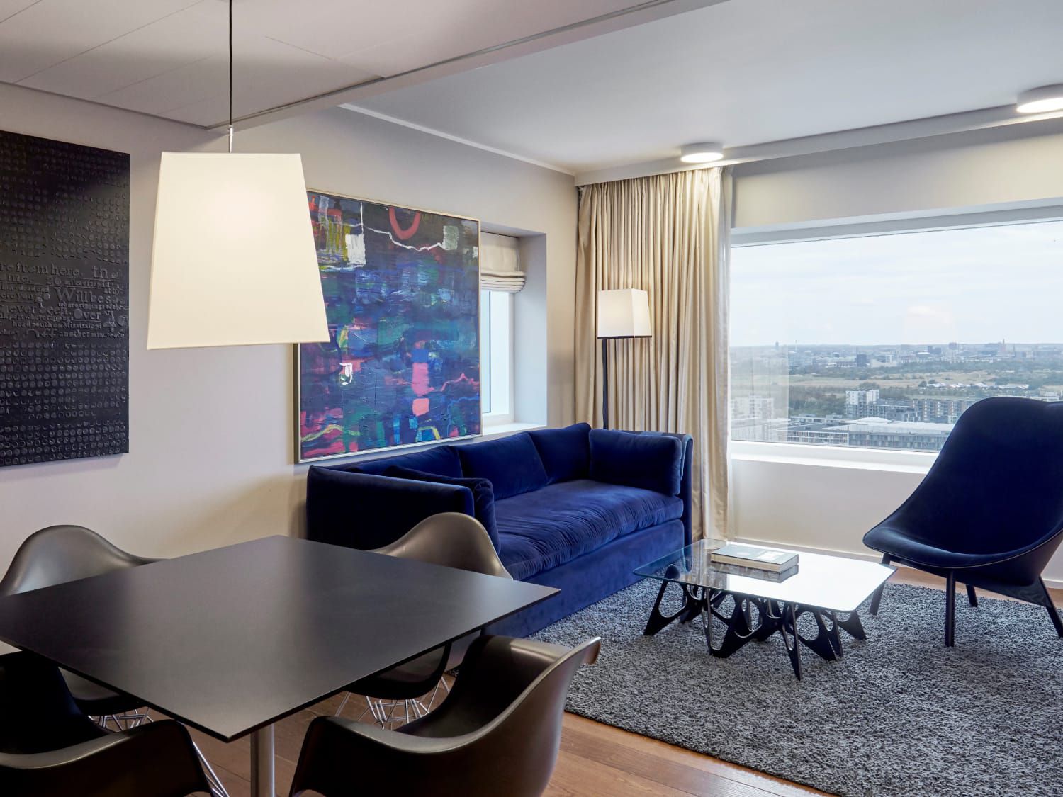 The One Bedroom Suite at the Crowne Plaza Copenhagen Towers includes living and dining space.